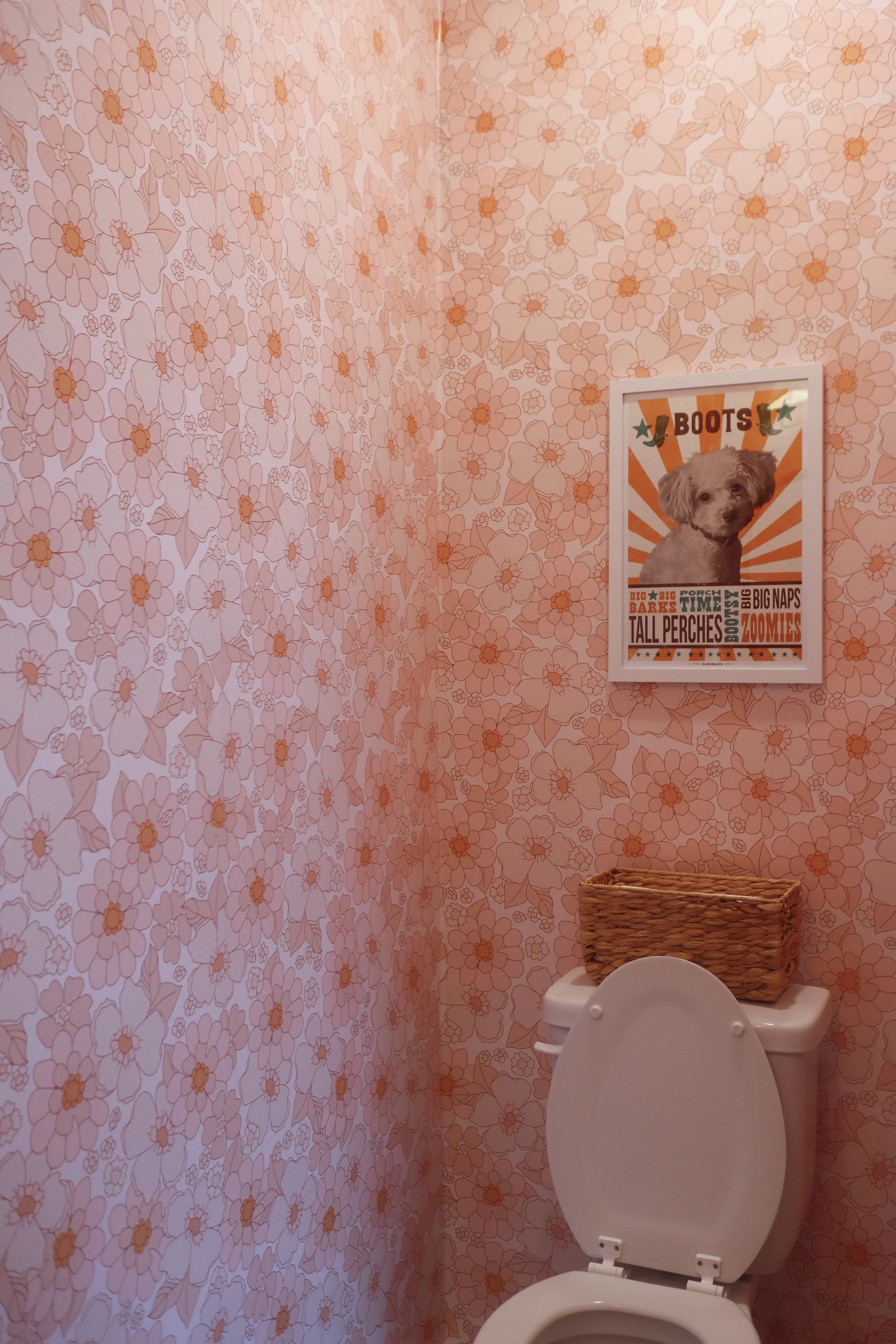 Pink Floral Powder Bath with Full-Wall Wallpaper and Retro 70's Style