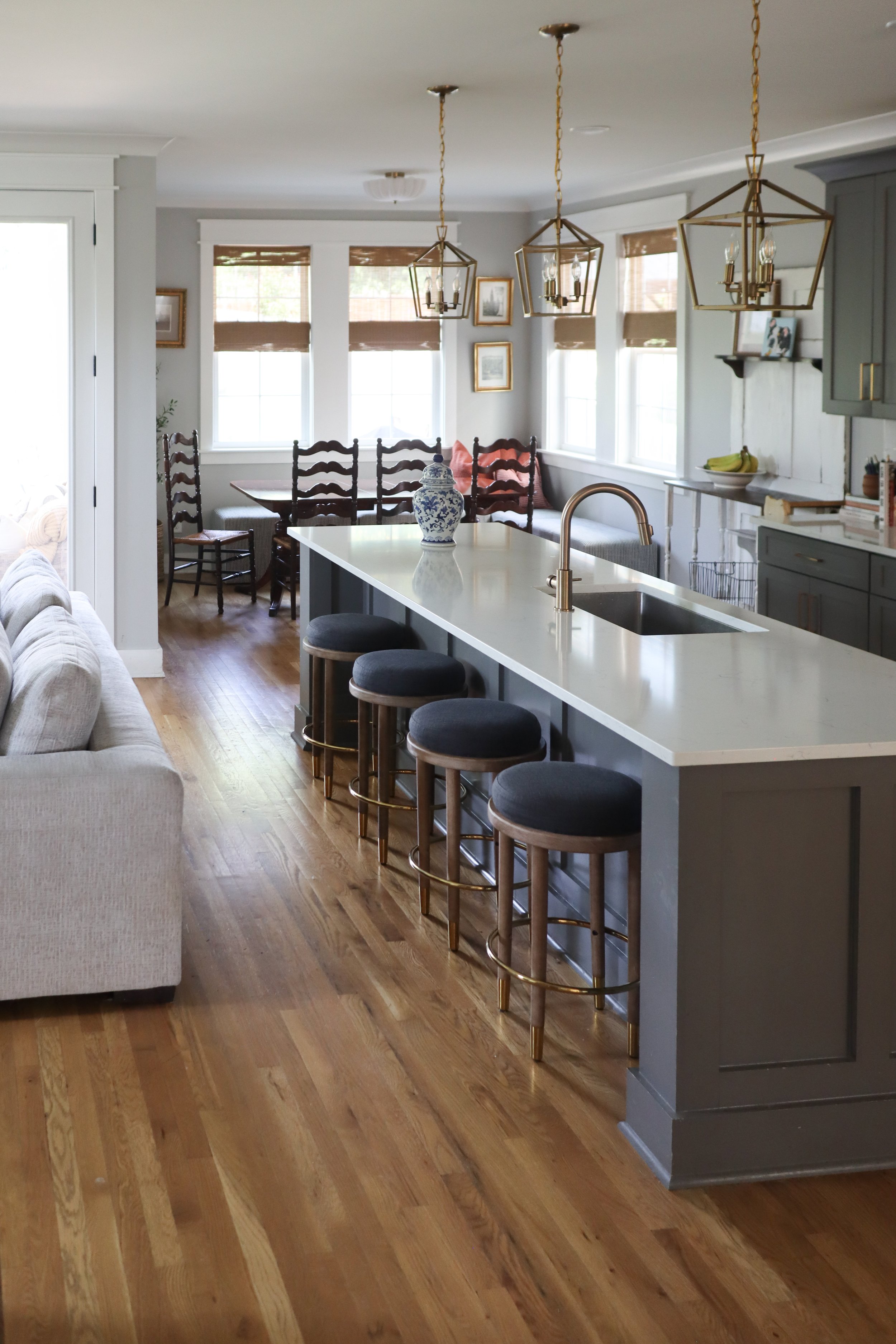 Downstairs design featuring traditional style in the kitchen, dining, and living room. Designed for a Nashville family who wanted warm finishes, timeless details, and functional flow between spaces.