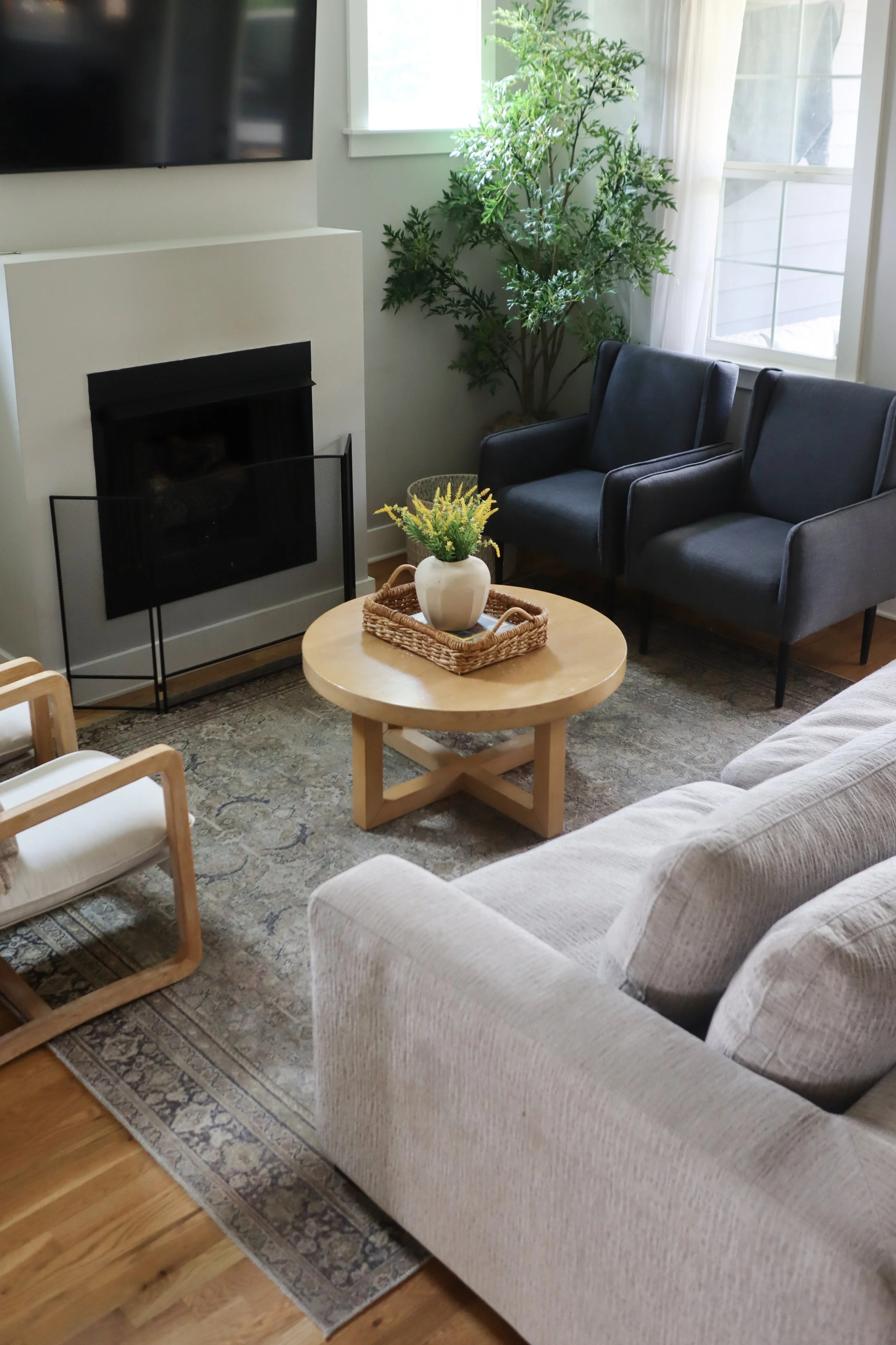 Downstairs design featuring traditional style in the kitchen, dining, and living room. Designed for a Nashville family who wanted warm finishes, timeless details, and functional flow between spaces.