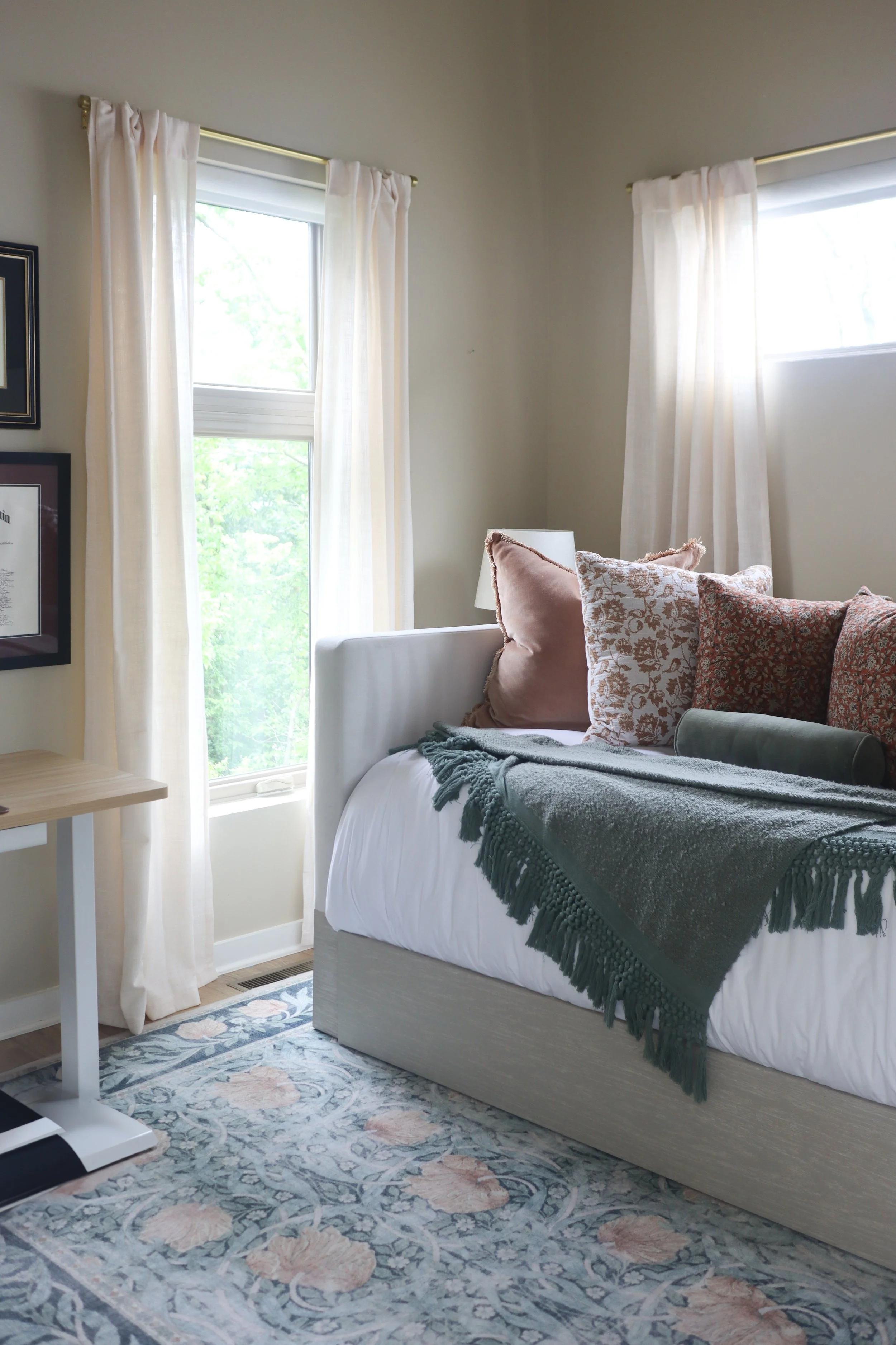 Desk nook in the guest bedroom, styled for both work and rest with warm, neutral tones.