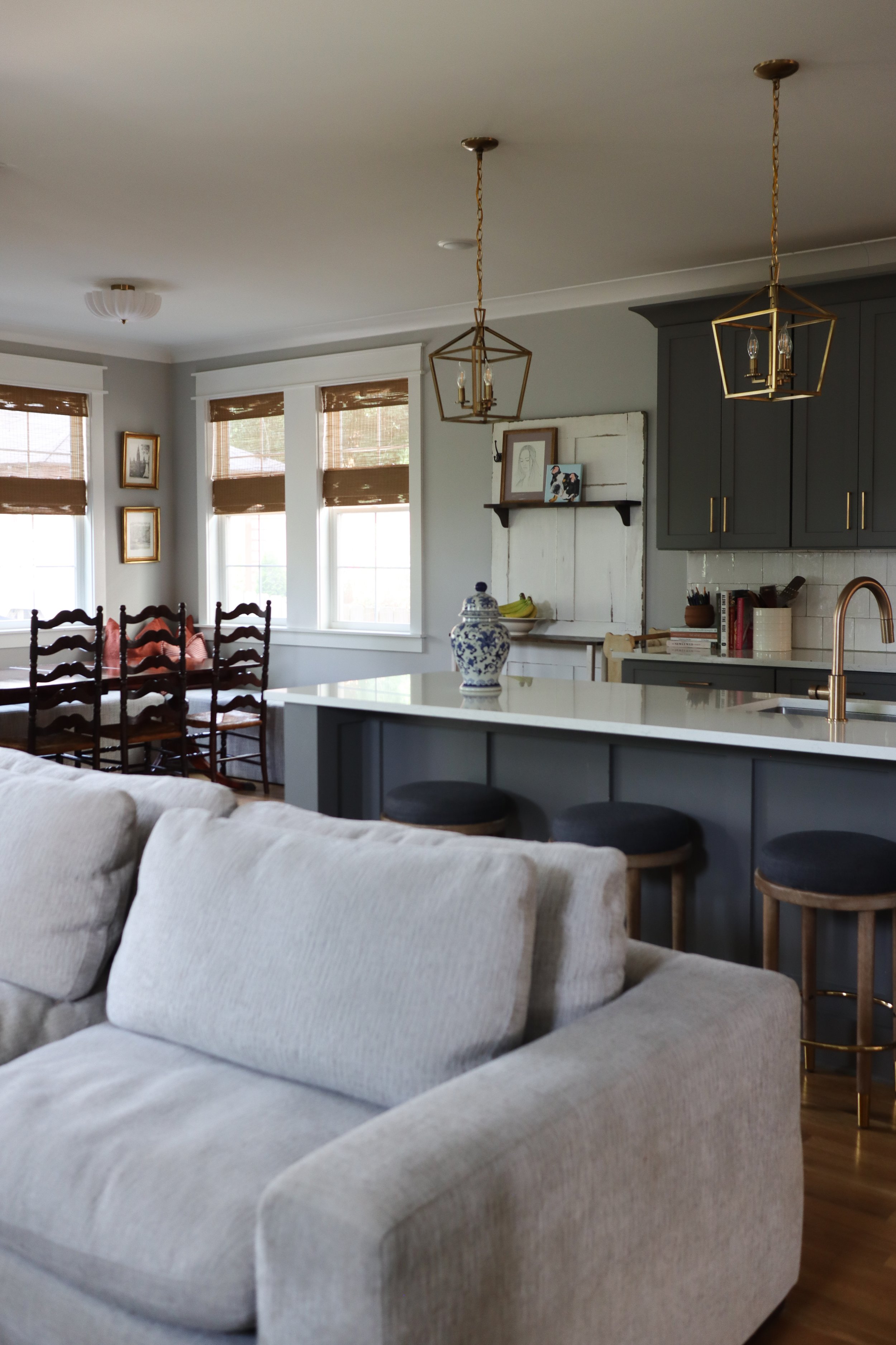 Downstairs design featuring traditional style in the kitchen, dining, and living room. Designed for a Nashville family who wanted warm finishes, timeless details, and functional flow between spaces.