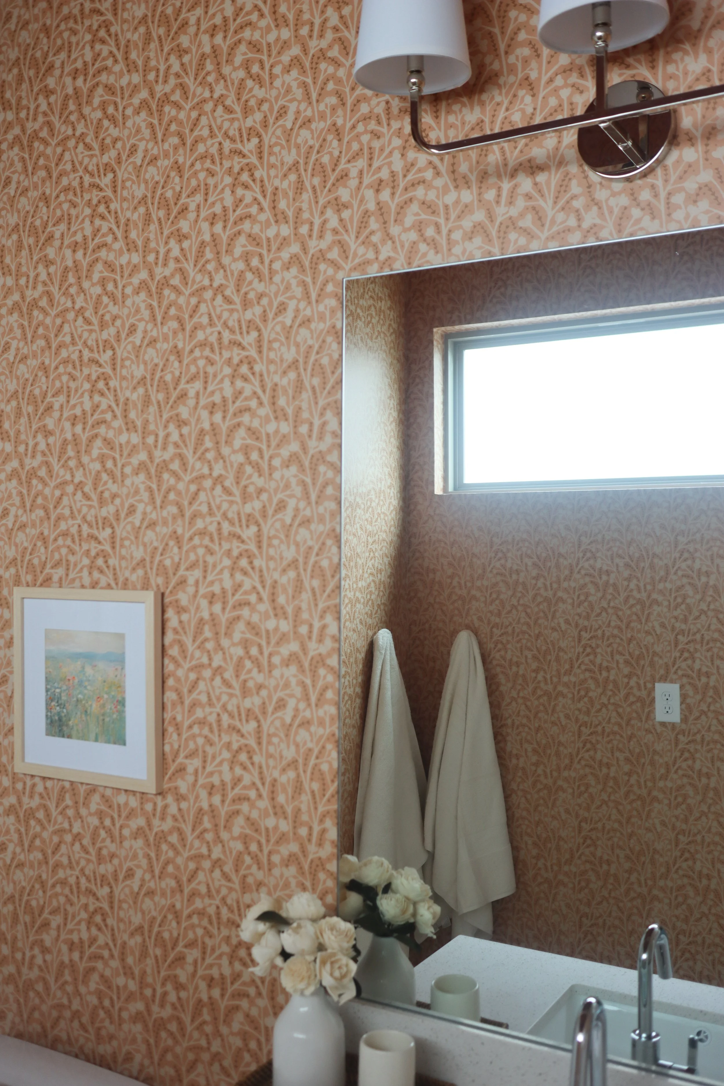 Wide shot of the guest bathroom showing a cohesive color story with the adjoining bedroom.
