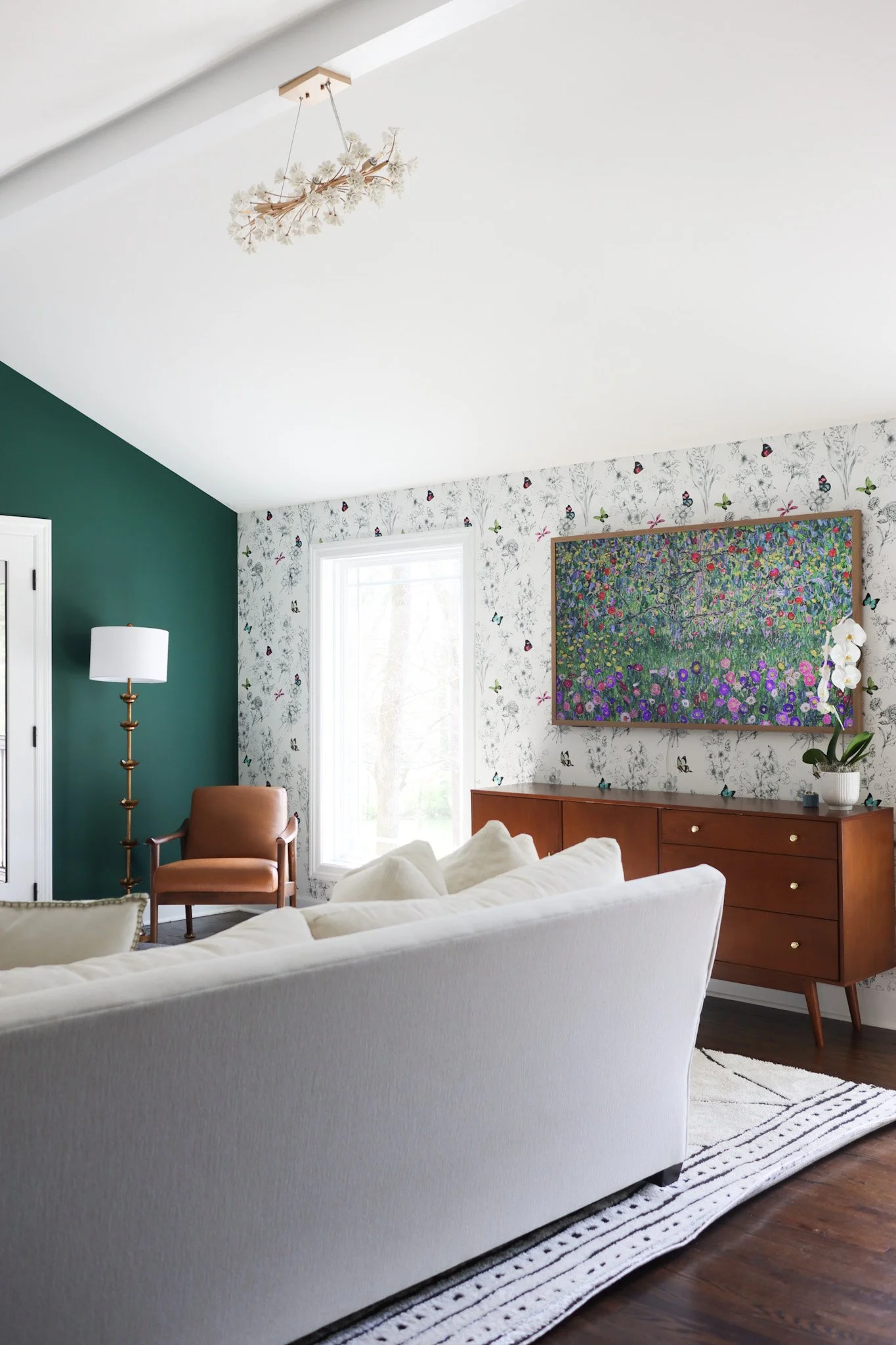 Living room featuring wallpaper accents, layered textures, and curated furnishings in a Nashville interior design project with a timeless, collected feel.