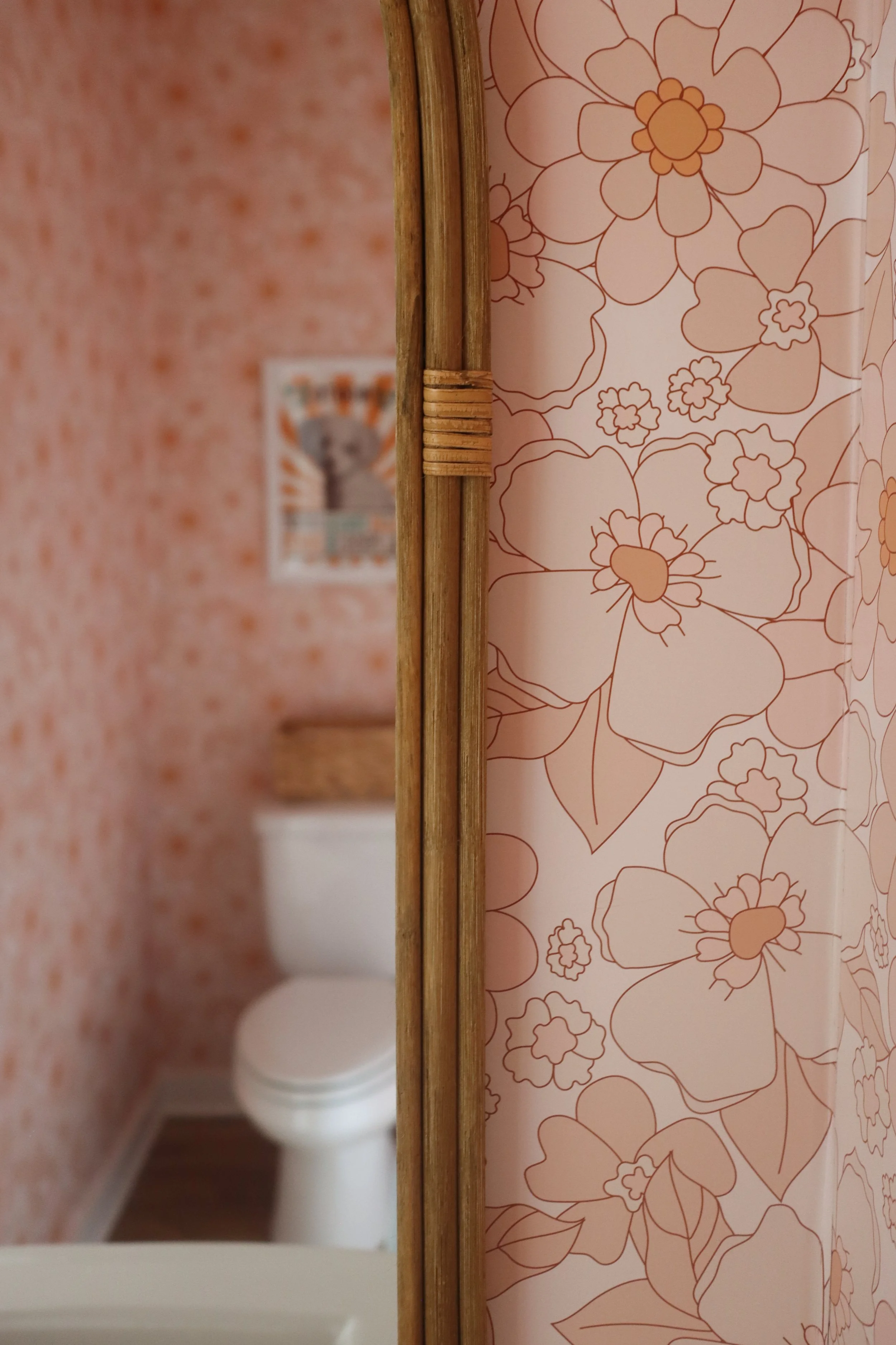 Pink Floral Powder Bath with Full-Wall Wallpaper and Retro 70's Style