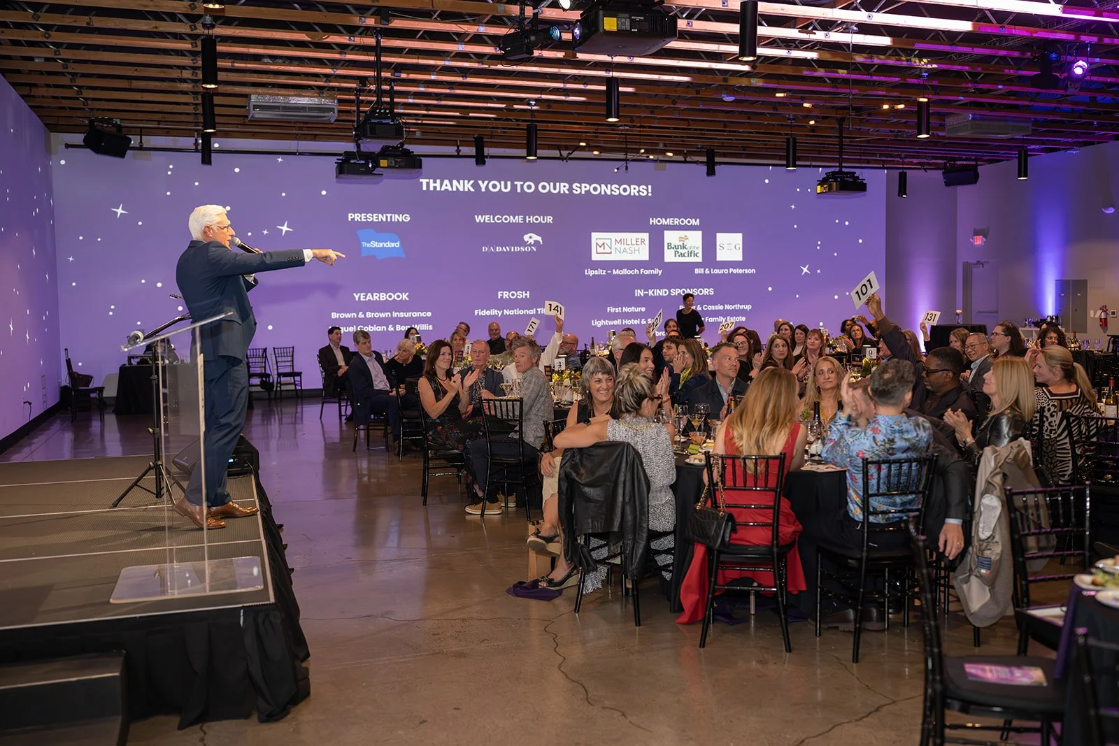 auctioneer Dale and attendees at Open School Gala 2026