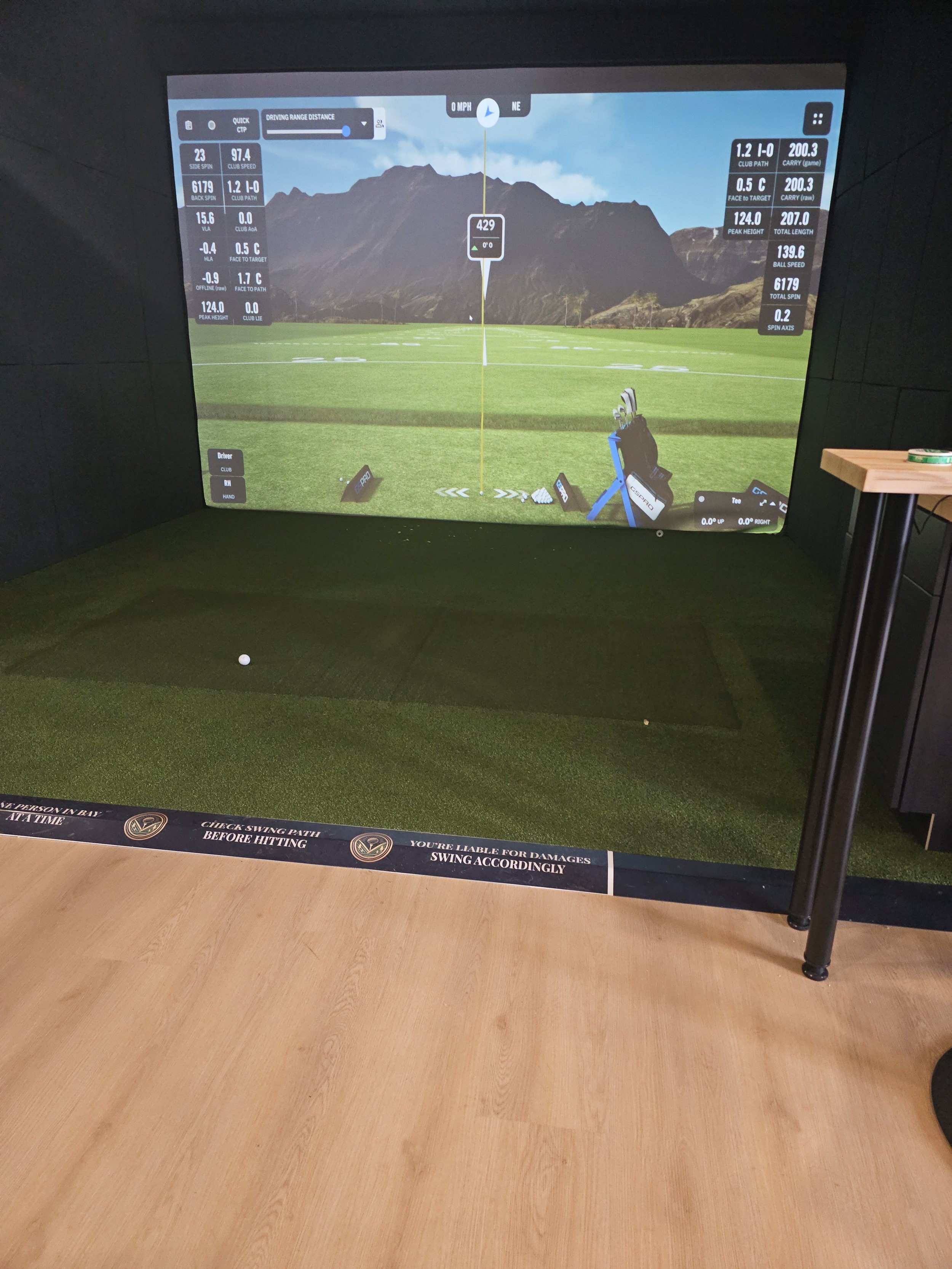Golf Simulator showing the driving range on screen
