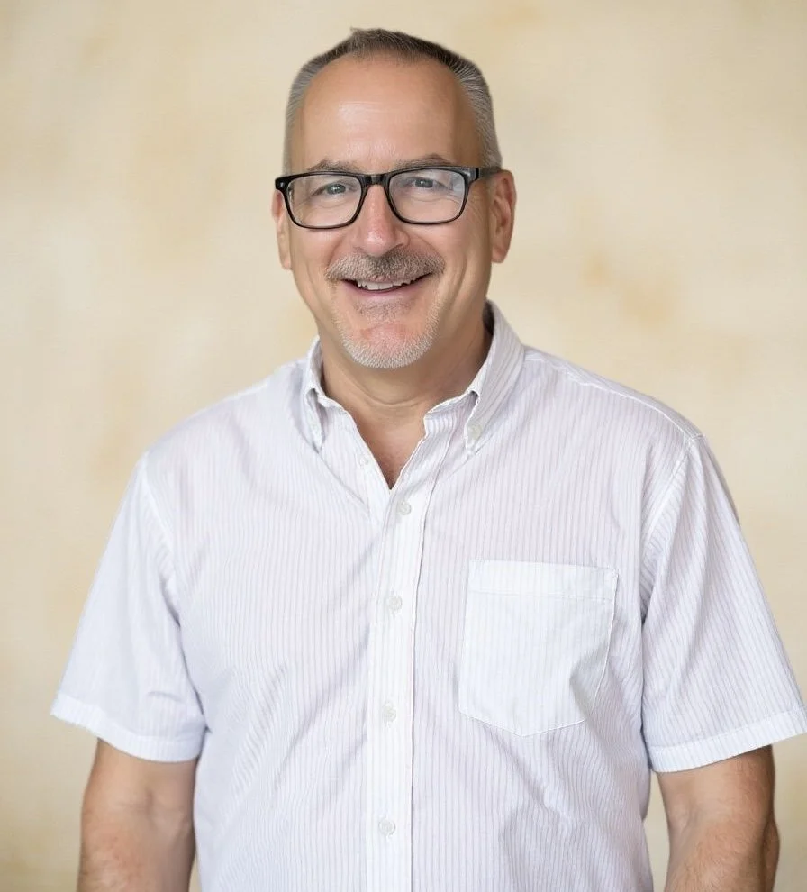 Joel McCabe wearing a white shirt