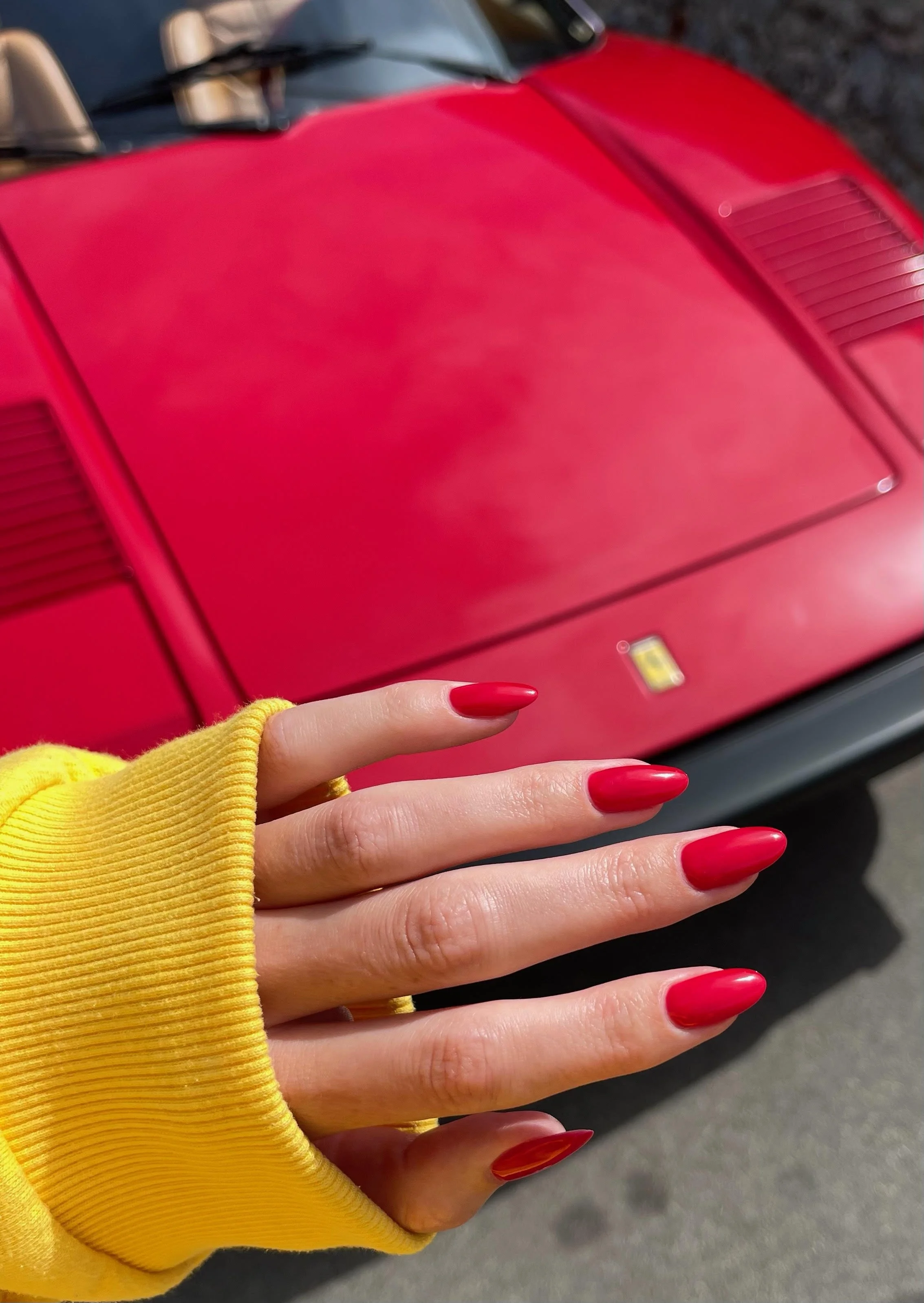 Red gel manicure by nail tech Sydney Roper at LDM Hair, West Hollywood