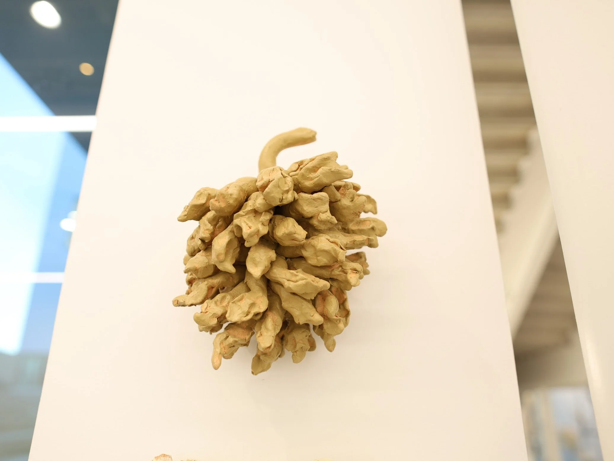 close up of "items", ceramic and house paint, 2025