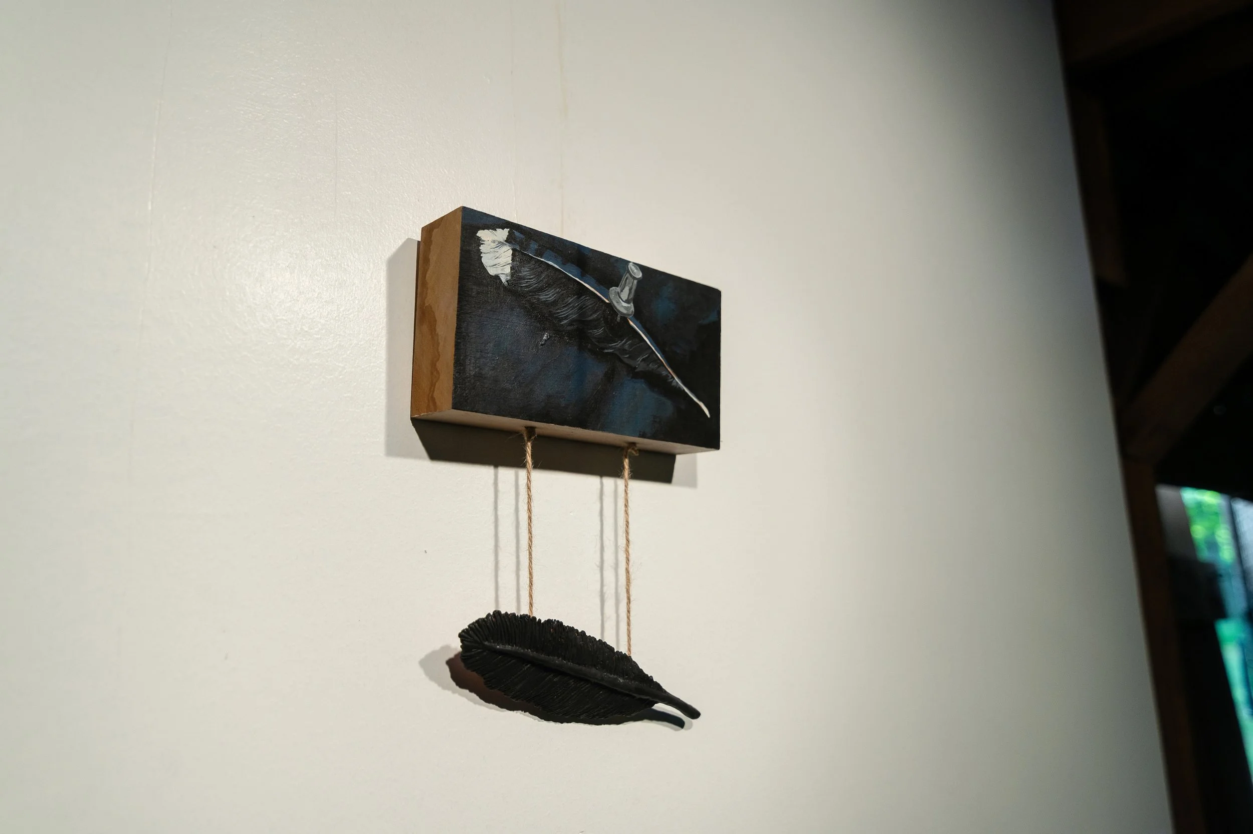 Feather, ceramic and acrylic painting on angrie wood, H15" x W11", 2026