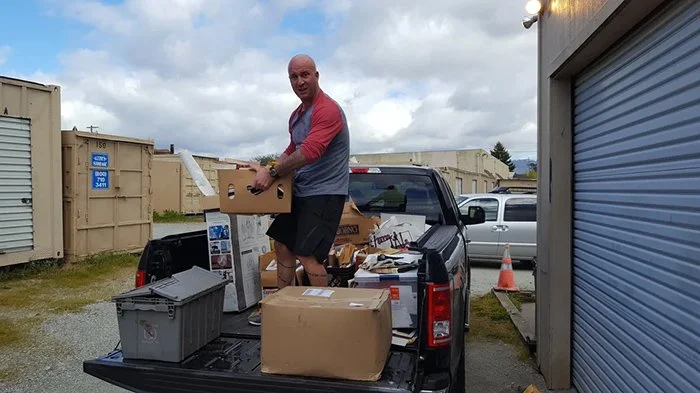 Volunteer helping a veteran with moving