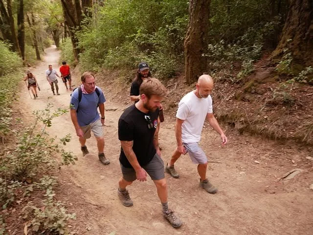 Members hiking on a trail