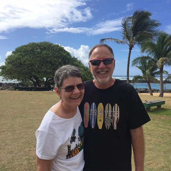 John and Elaine C. in Kauai, Hawaii, with John wearing a Vets 4 Vets shirt
