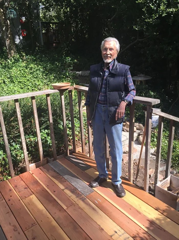 Person standing on a wood deck