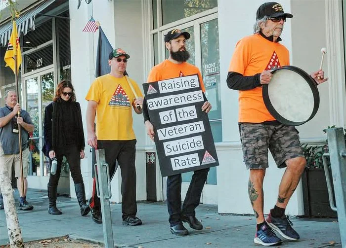 Veterans Day ghost chairs walk in downtown Santa Cruz.