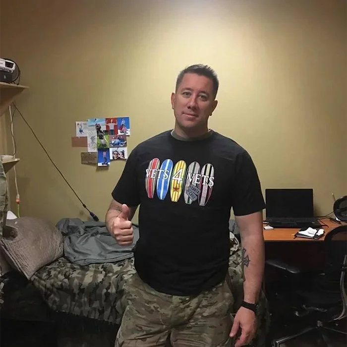 SFC. Henderson in Afghanistan wearing a Vets 4 Vets shirt.