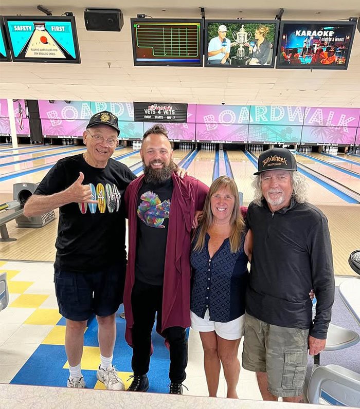 Members posing for a picture at Boardwalk Bowl in Santa Cruz