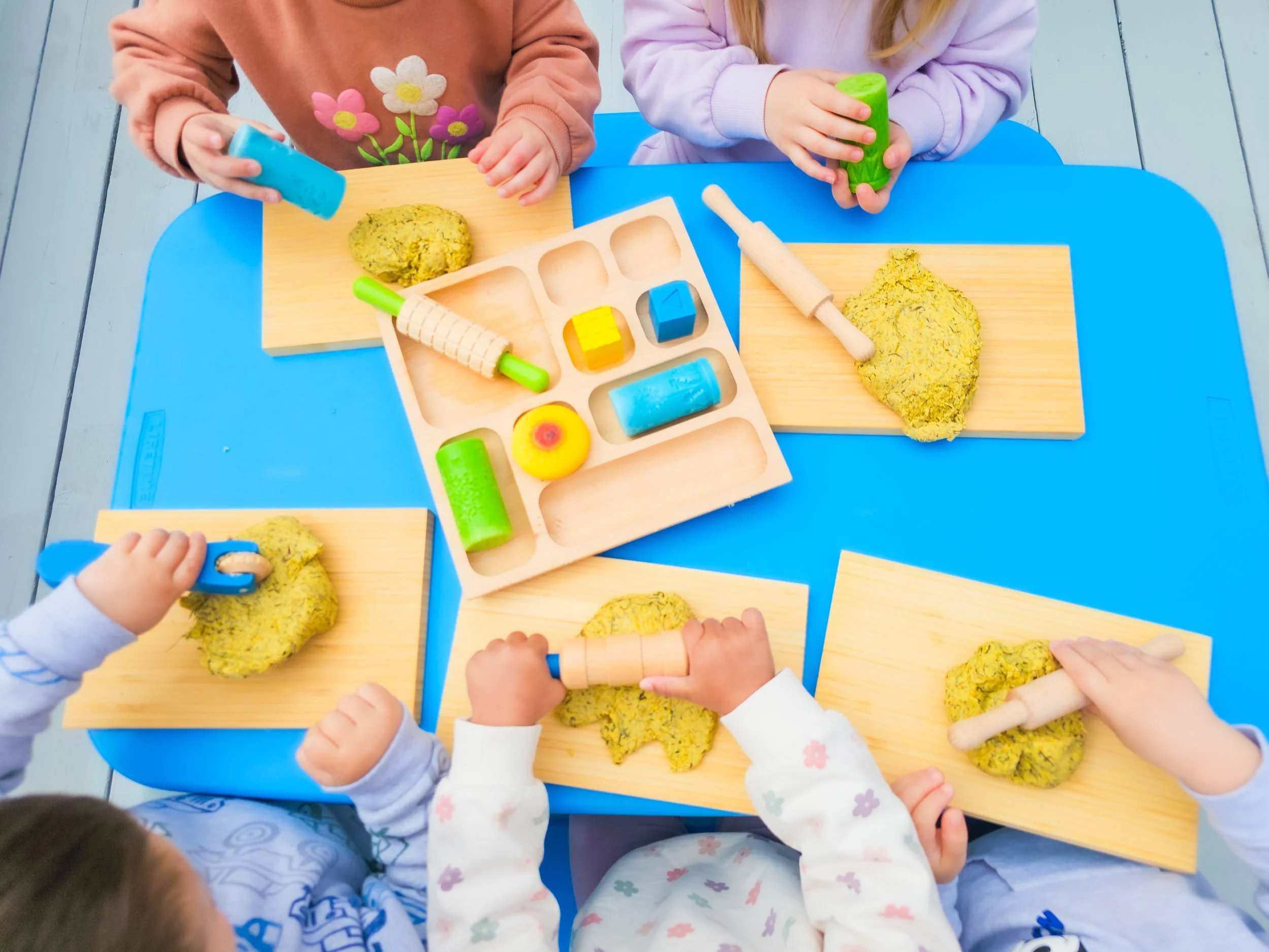 Enjoying the fruits of their labor with a fresh batch of dandelion playdough! 😊