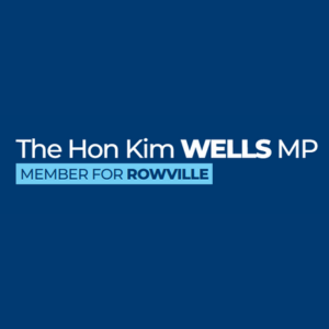 Text on a dark blue background showing: 'The Hon Kim Wells MP, Member for Rowville'.