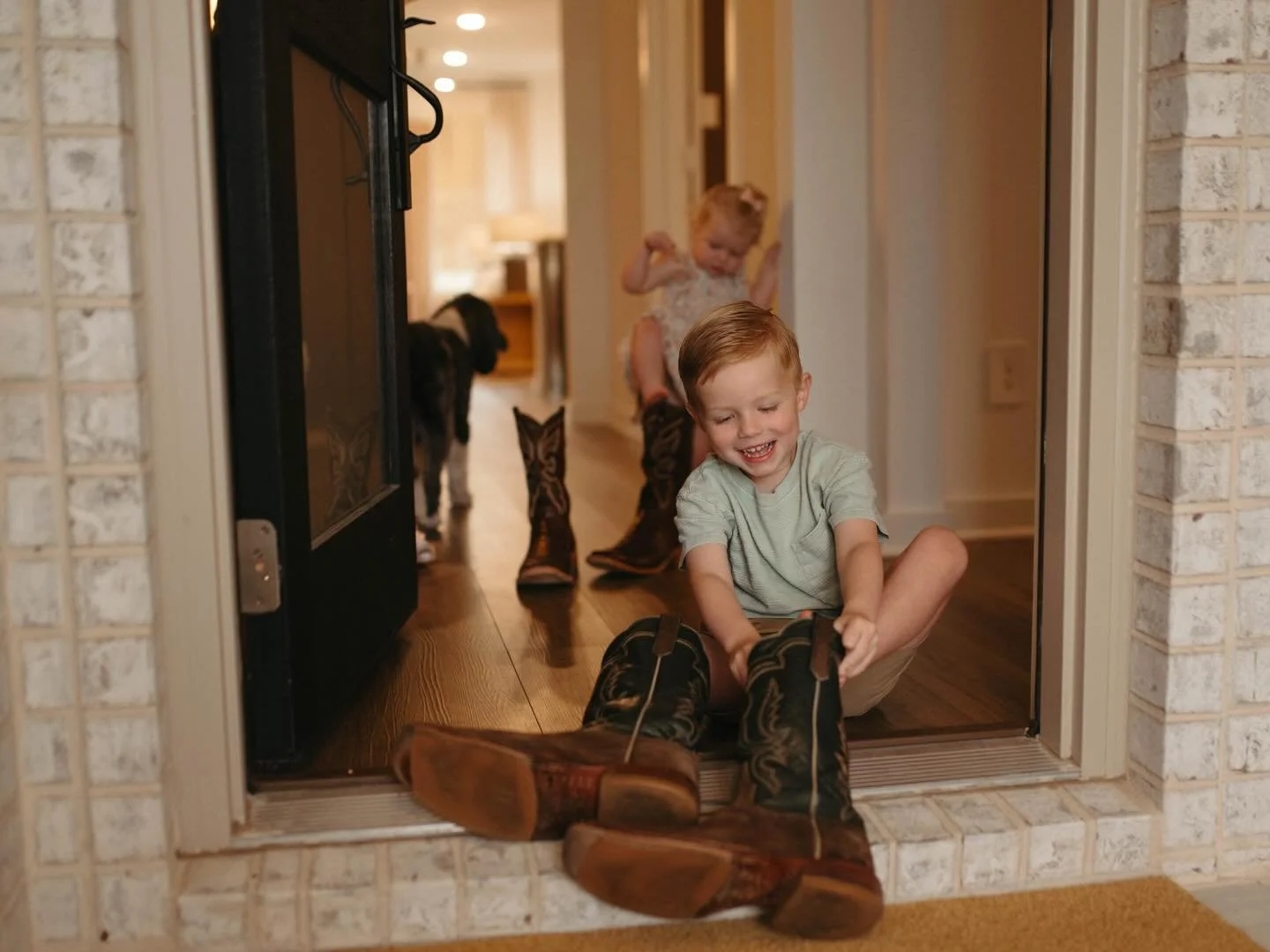 Sometimes it is the smallest things that stay with you.

The way they wanted to be just like dad, wobbling around in his boots before heading outside.

The dog waiting at the door and instantly greeting you..

The quiet movement through the house at 