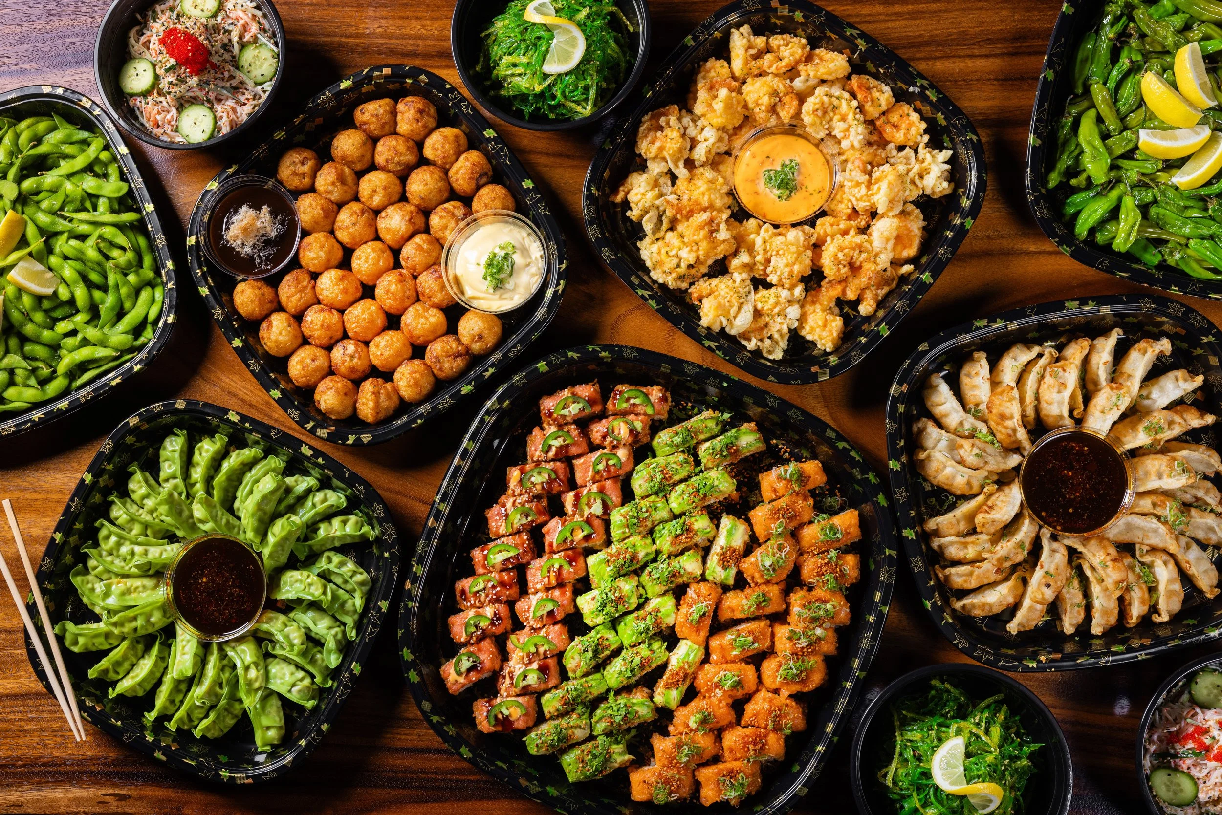 suram catering platters, crispy rice, popcorn chicken, gyoza platter