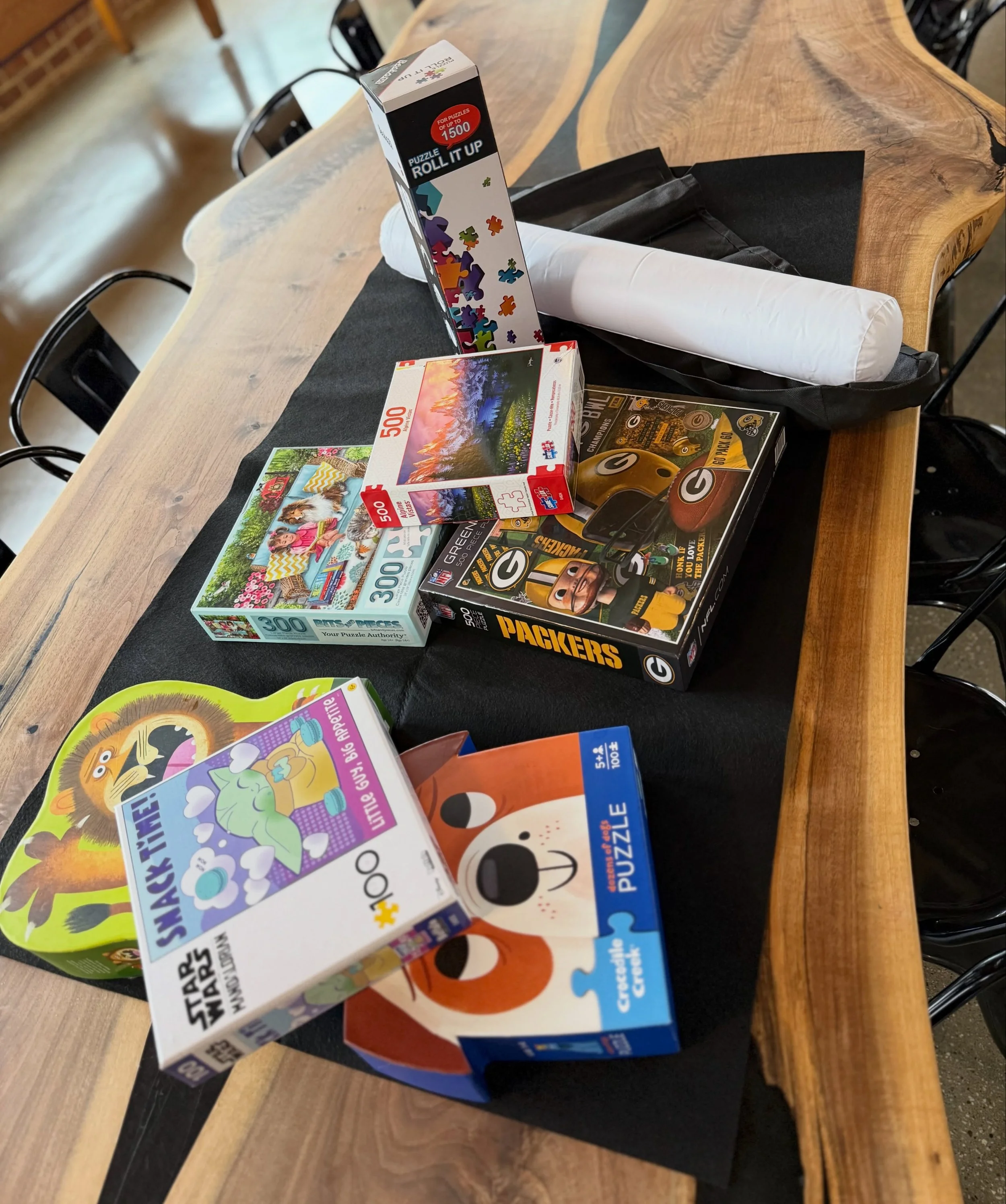ALL DAY LONG Pints &amp; Pieces: RAA Bi-Weekly Puzzle Day is ready for you! We even bought a PUZZLE MAT so we can save your work for the next puzzle day🧩 Puzzles, drinks, &amp; food available for all ages&mdash;stop in! 🎉
