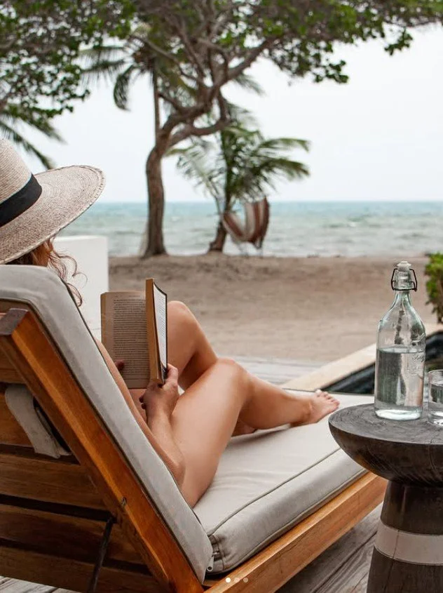 Reading on a beachfront lounger
