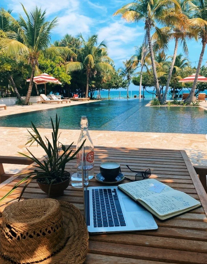 Working poolside at Itz'ana Resort during pool hours at the Belize therapist retreat