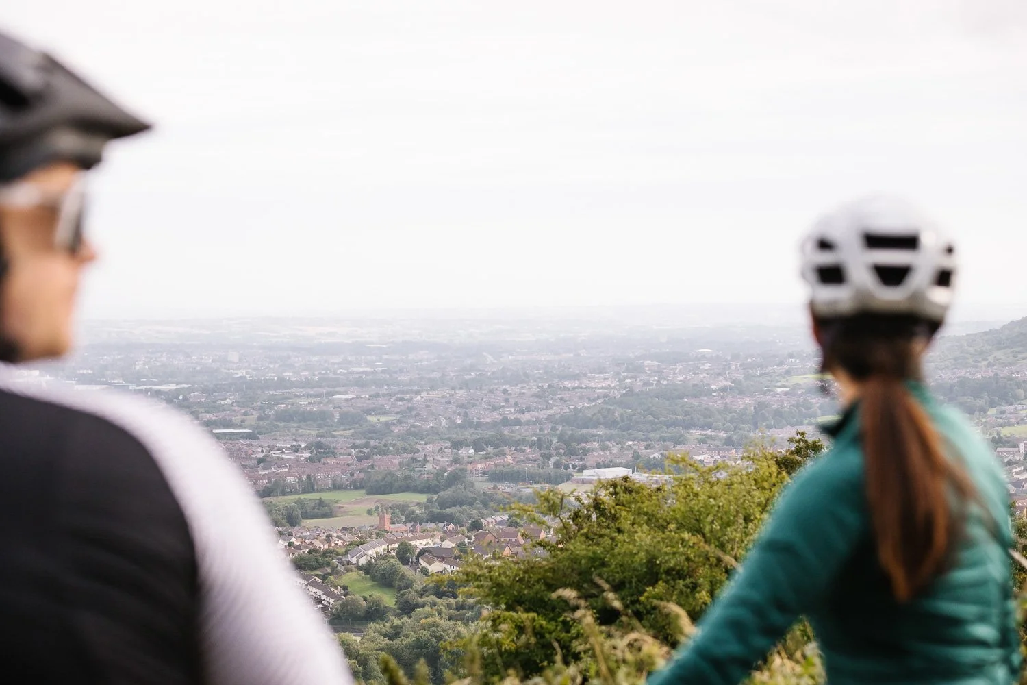 Gravel cyclists with view of Belfast from Cave Hill