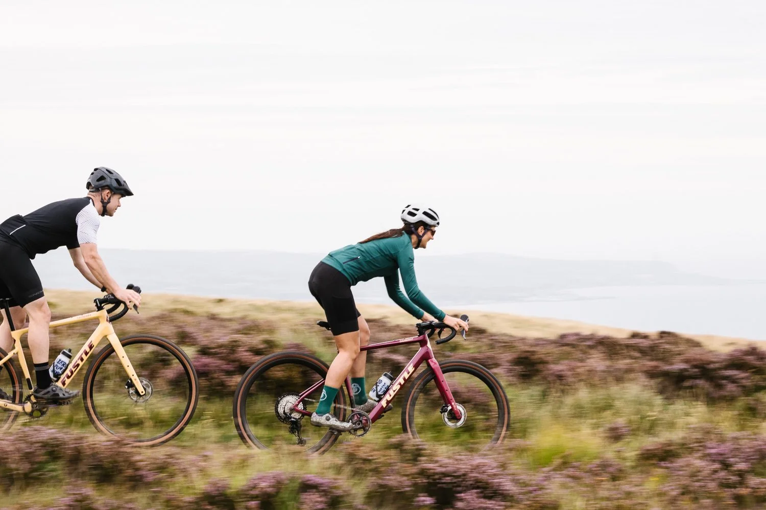 Panning photograph of cyclists on Fustle Causeway gravel bikes