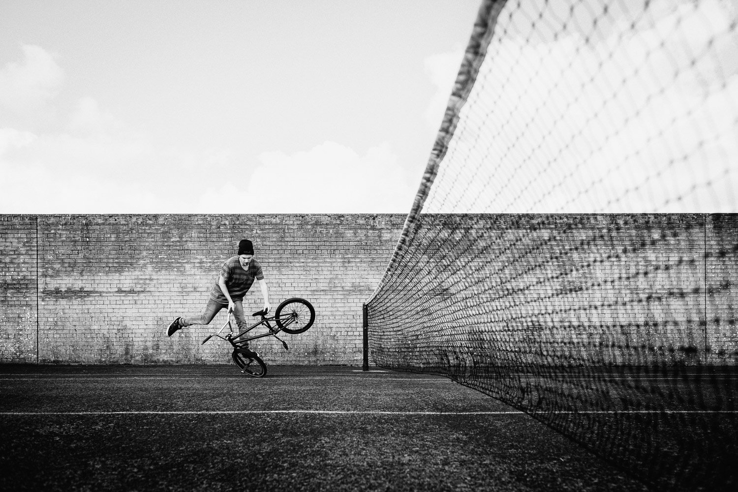 Flatland BMX rider in black and white