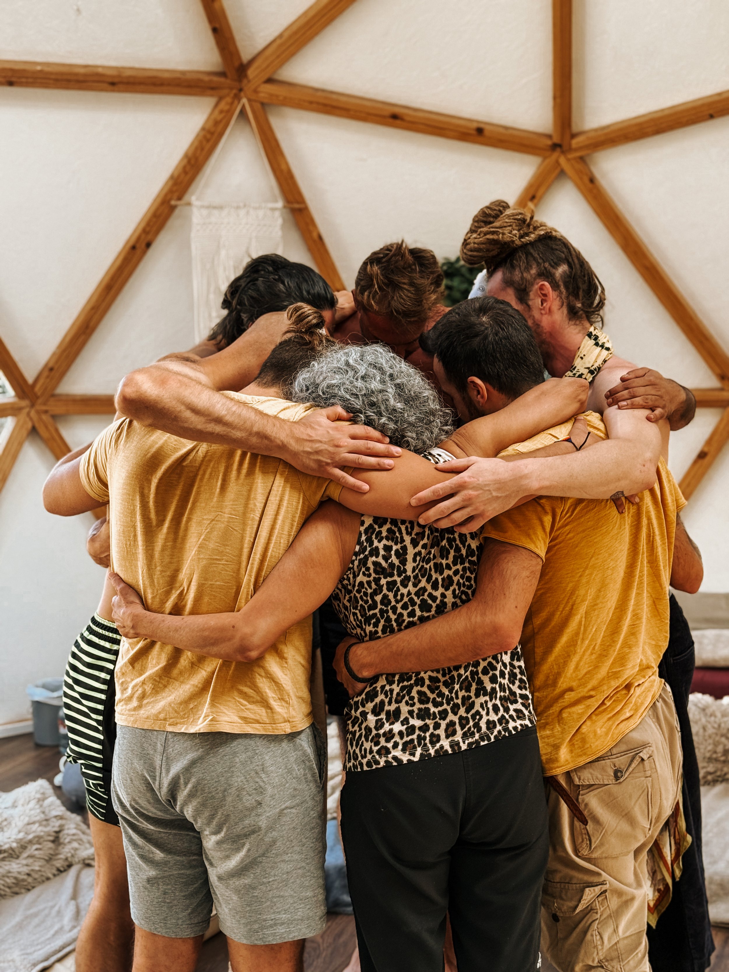 Group of people meditating at a retreat
