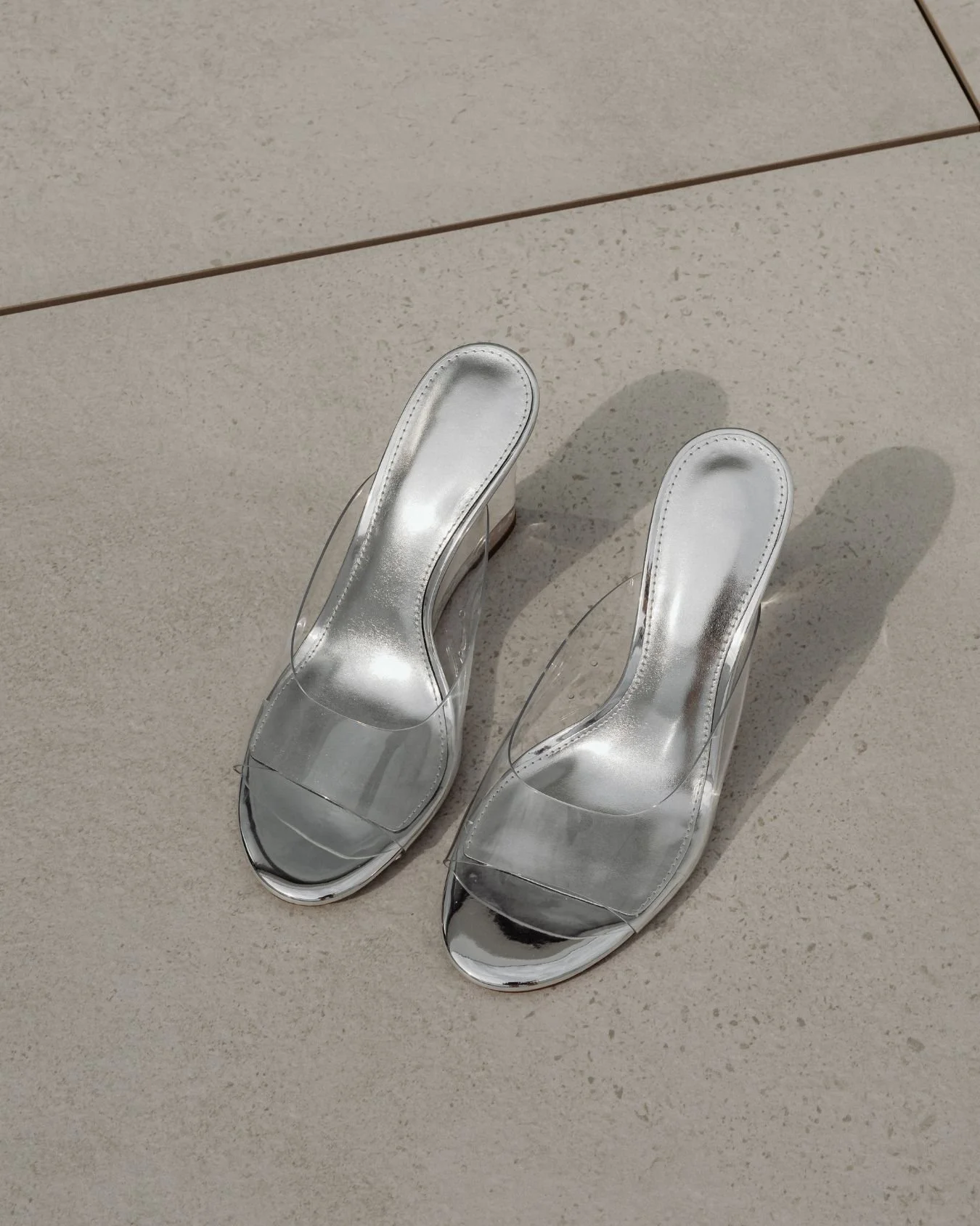 A pair of silver wedding shoes.