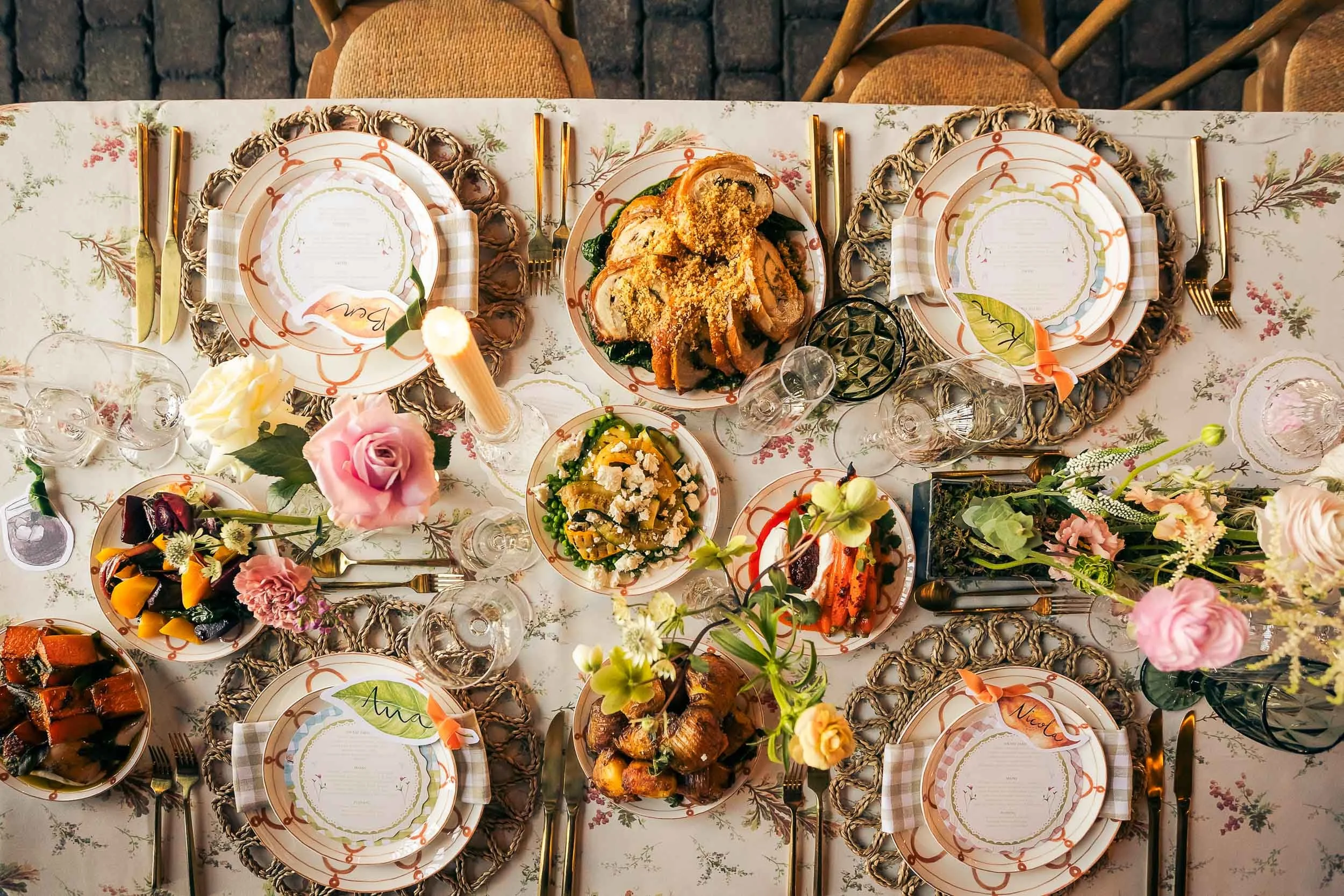 A pretty wedding table with a colourful, seasonal feast laid out.