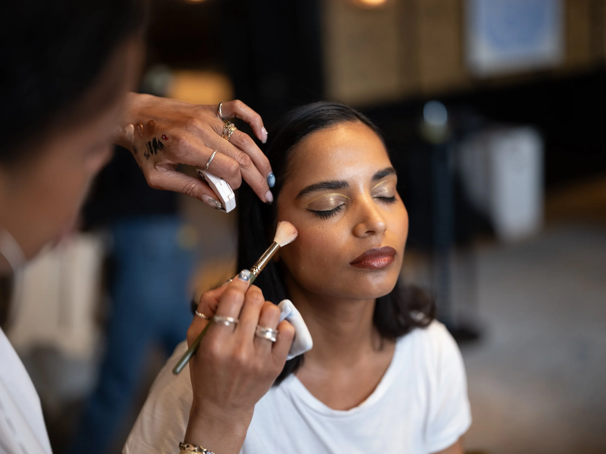 A beautiful bridal makeup look by Powder Blue Artistry, featuring flawless glowing skin, golden eyeshadow, and soft bronze tones. Professional makeup artist Carina, creates a timeless, radiant finish perfect for modern UK weddings and elegant bridal 