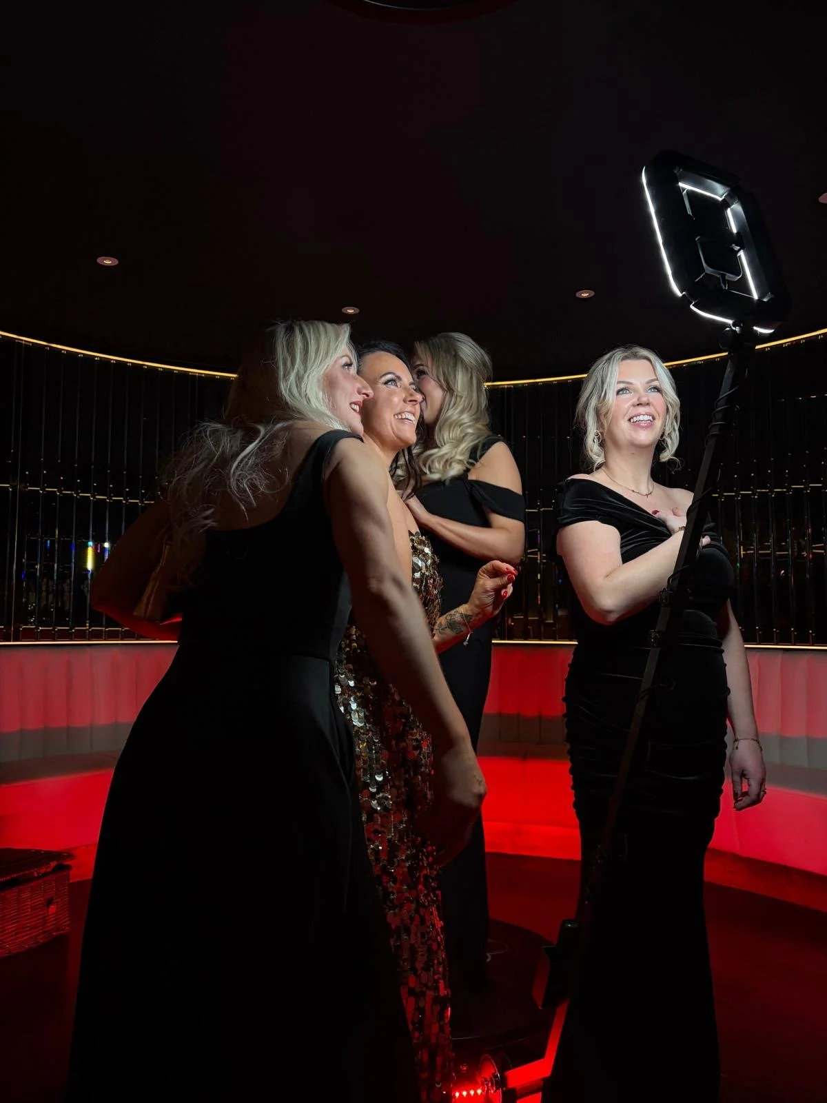 Guests at a wedding posing in front of Mark the Event's Selfie Pod. 