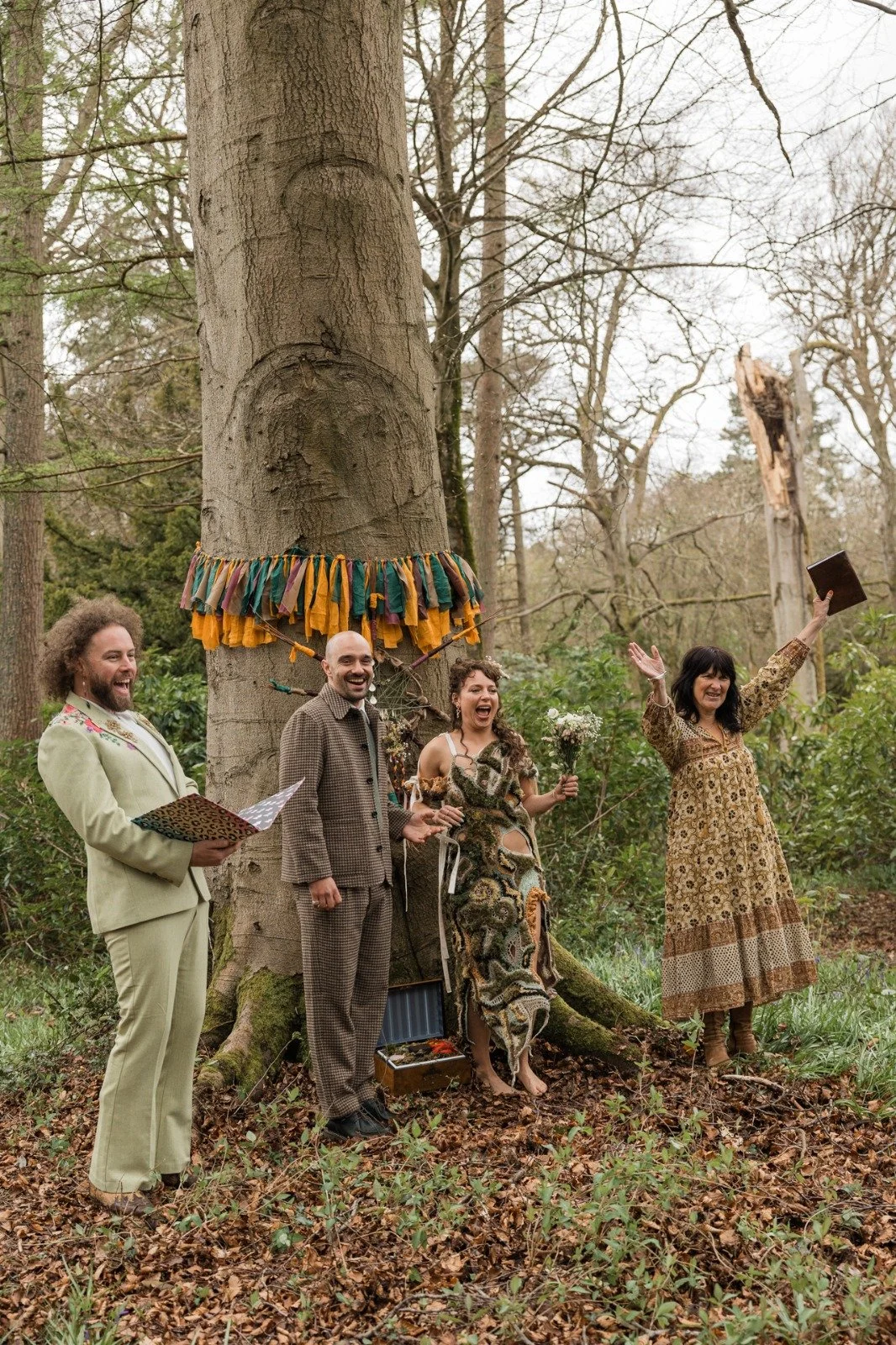 An alternative outdoor wedding ceremony led by celebrant Lonan Jenkins, featuring colourful outfits, live music, heartfelt rituals and relaxed, inclusive celebrations surrounded by nature.