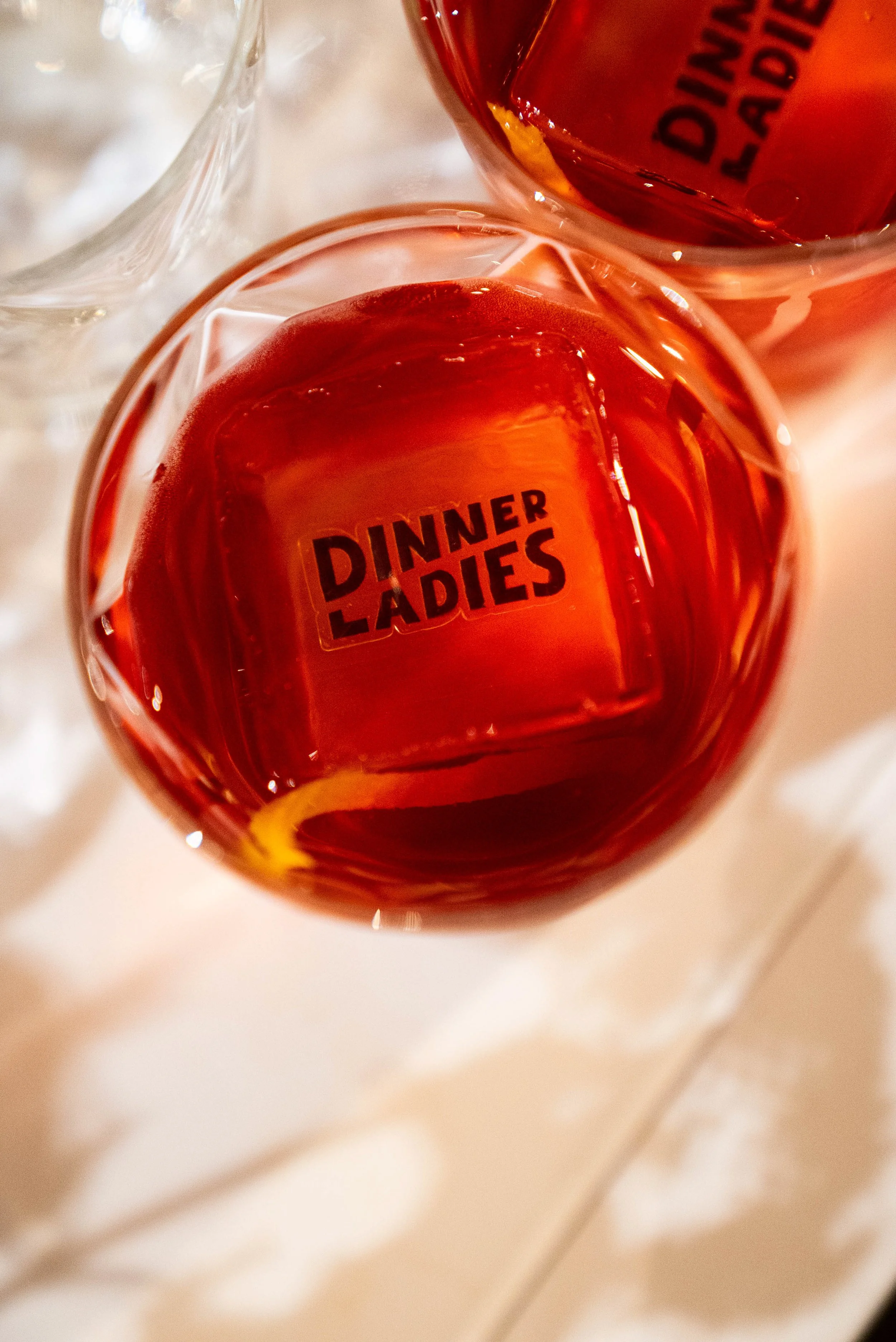 A Dinner Ladies branded ice cube.