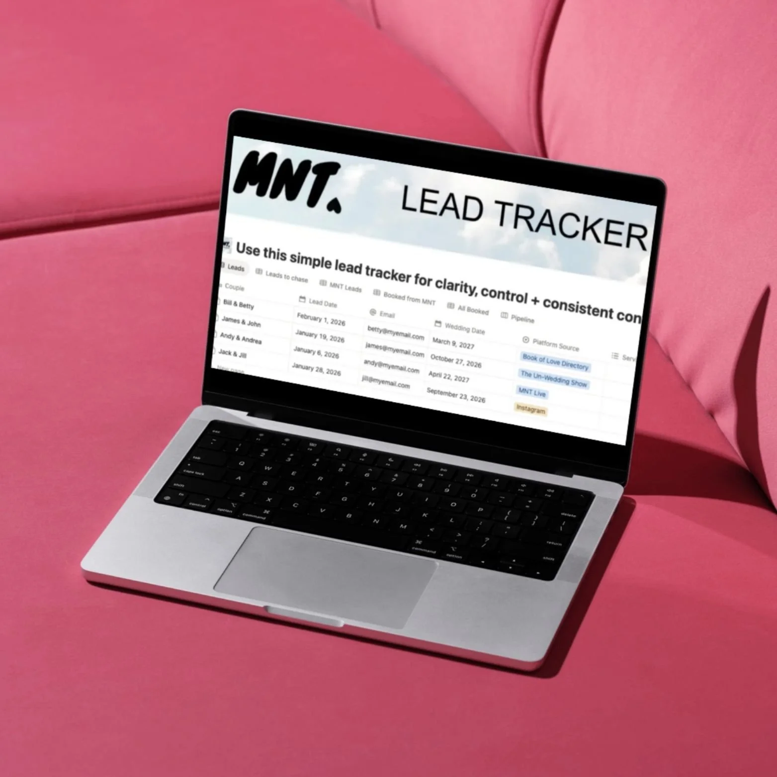 A laptop on a pink sofa with the MNT Lead Tracker in use.