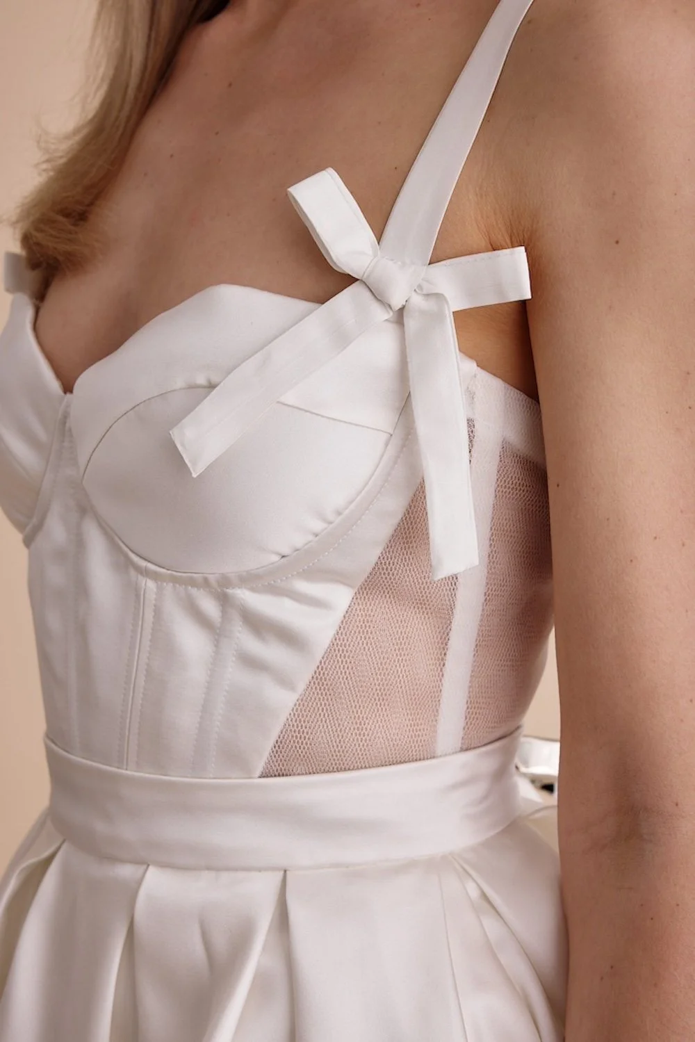 A close up of the top part of an unpcycled wedding dress by Swans Bridal, West Sussex. Photo by 