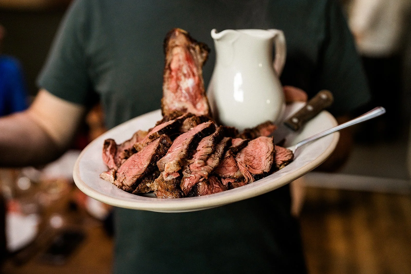 A plate of roast beef and gravy at a pub wedding reception.