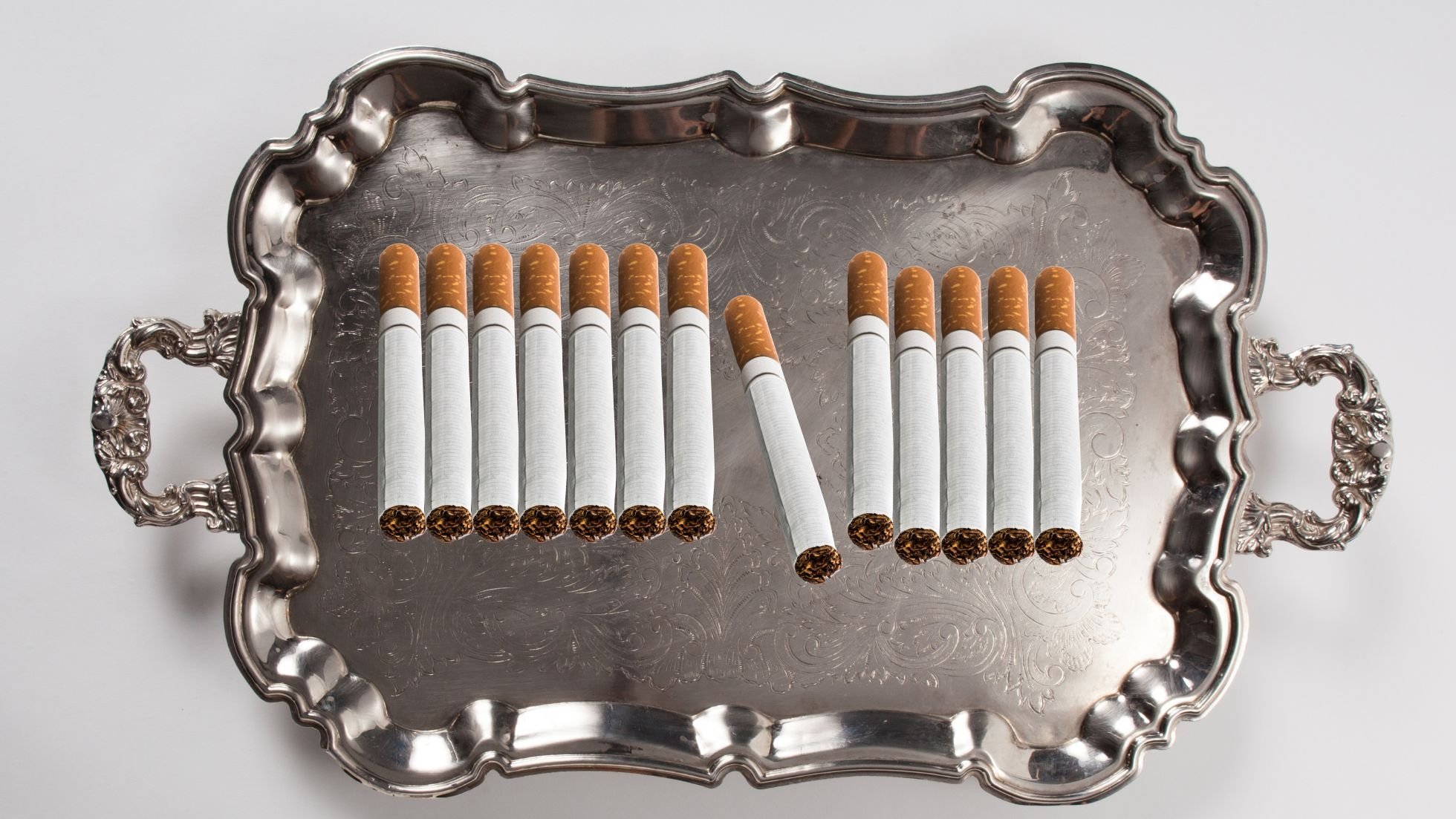 A silver platter of cigarettes.