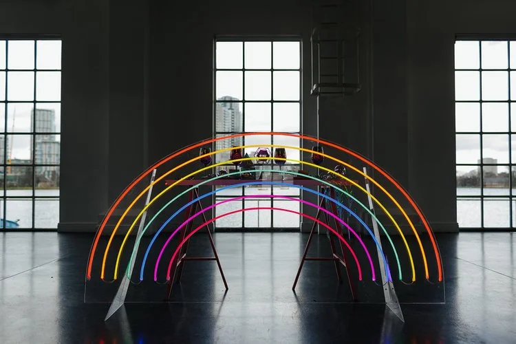 Vowed and Amazed neon rainbow arch with vibrant multicolored lights, a joyful and eye-catching backdrop for weddings, parties, and celebrations.