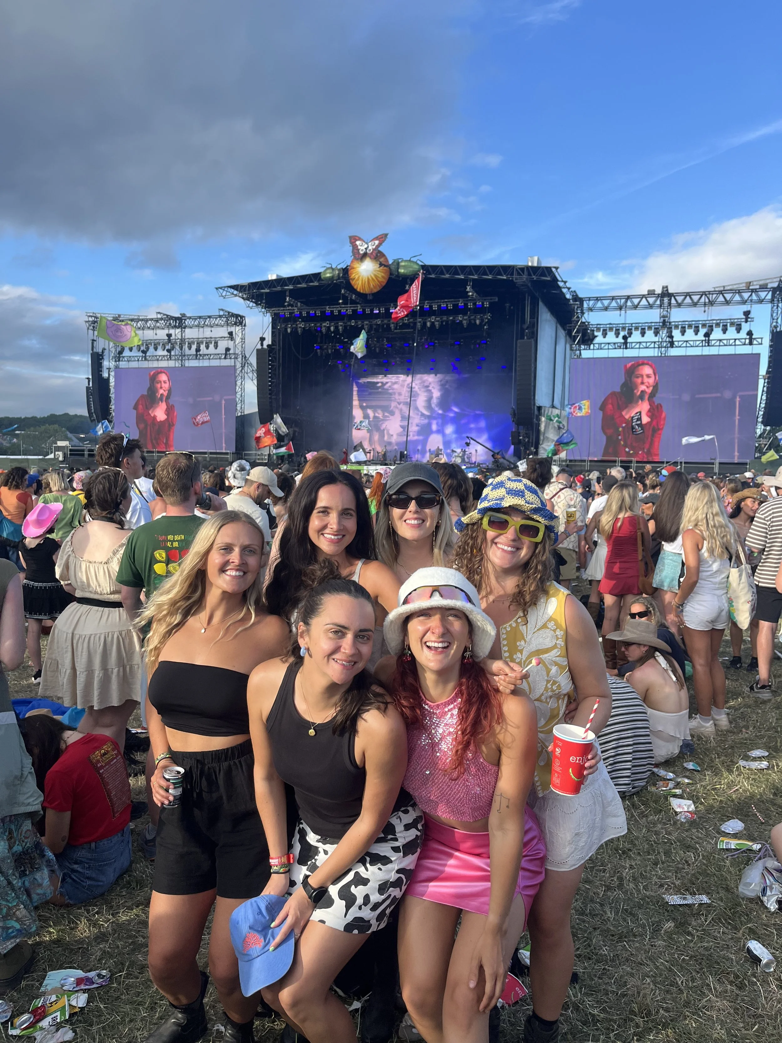 Robyn Smith, Wedding Celebrant, pictured with friends at a live music festival, surrounded by vibrant energy, community and celebration. This joyful, personality-filled image reflects the warmth, inclusivity and love of a great party that Robyn bring