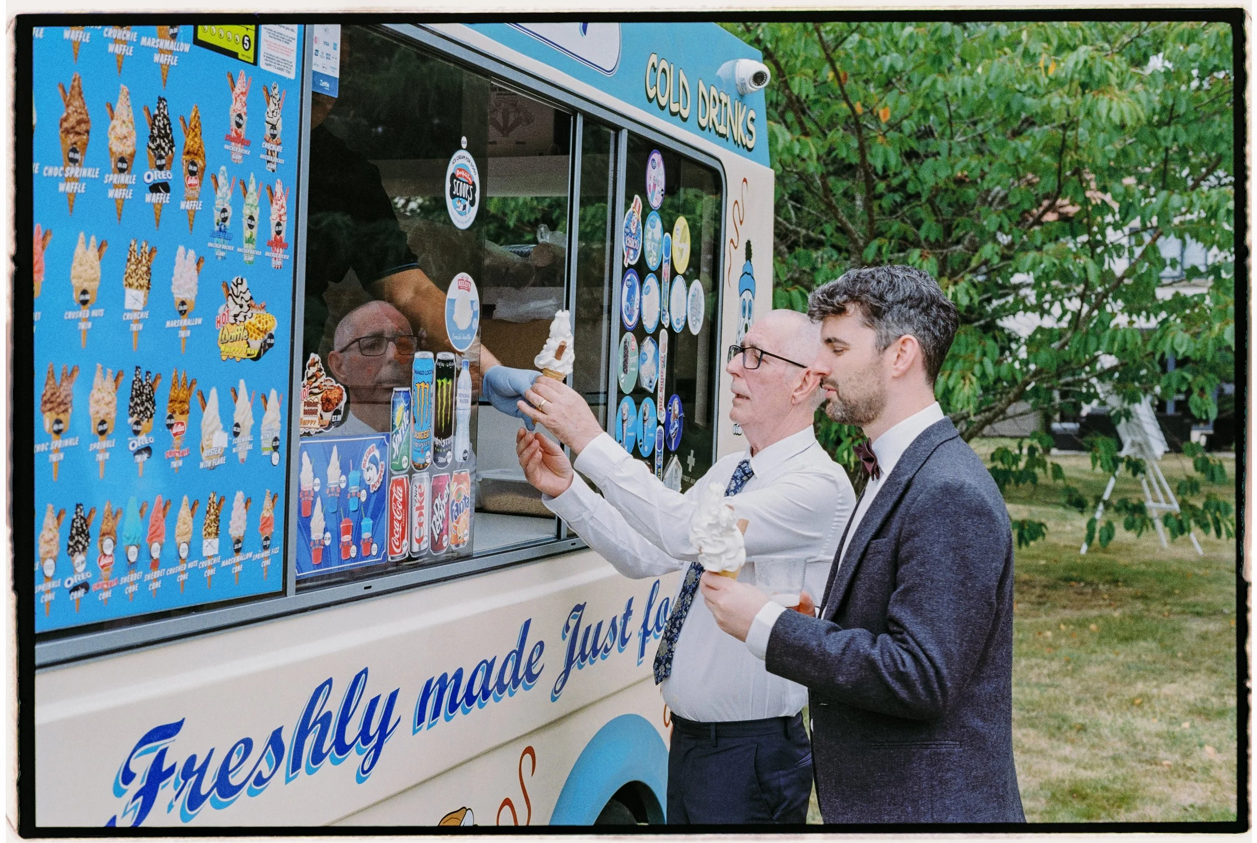 A perfect Big Sister Events moment: guests queuing at an old-school ice-cream van, sleeves rolled up, cones piled high, and everyone grinning like kids again - the kind of playful, joy-filled detail that turns a wedding day into an experience people 