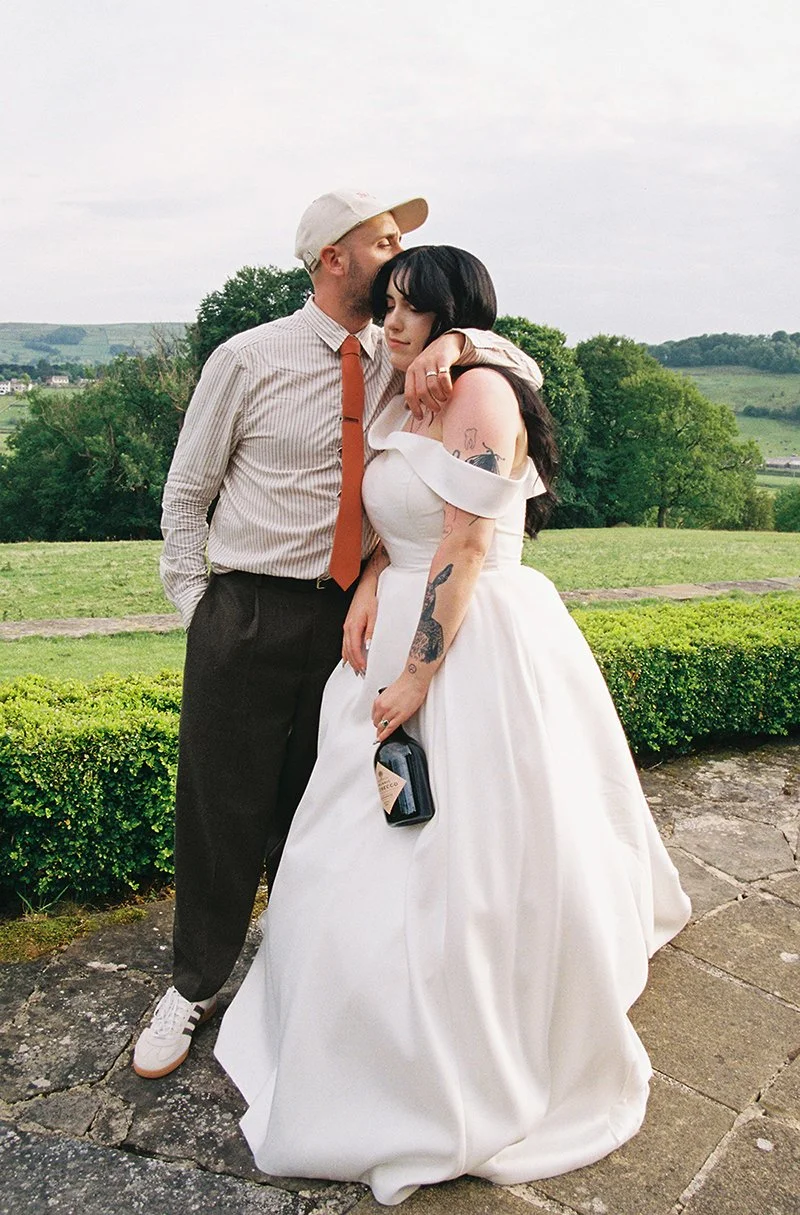 Elizabeth Royse Photography captures weddings with a raw documentary sensibility that prioritises imperfect beauty and vivid atmosphere as seen in the bride sprinting down a mural lined staircase the smoky scene of a burning bouquet outside a barn gu