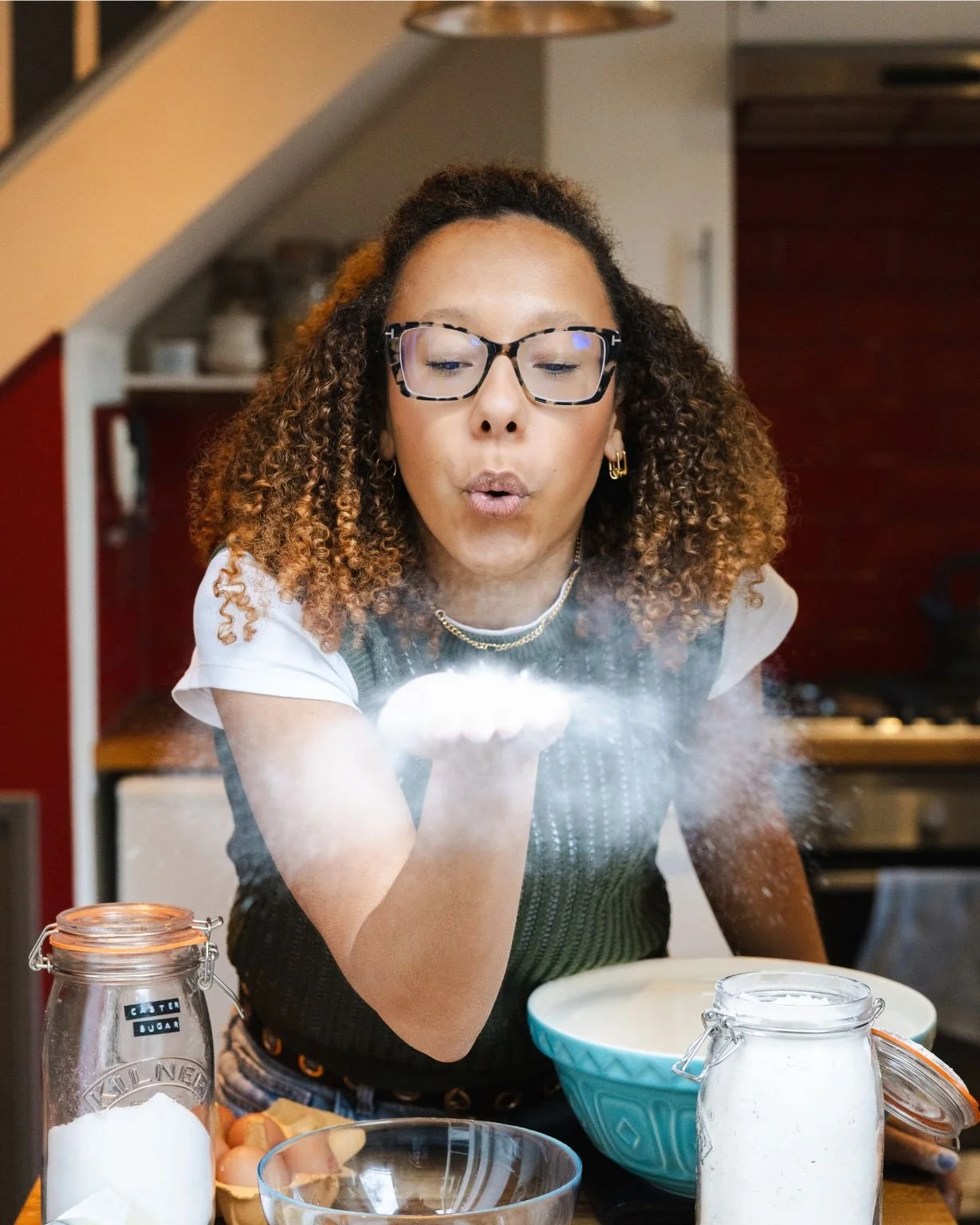 London wedding cake maker Amelia also known as The Cake Hun, in the kitchen, captured mid-preparation. A modern, design-led cake studio specialising in retro-inspired wedding cakes, handcrafted buttercream finishes, and creative celebration cakes for