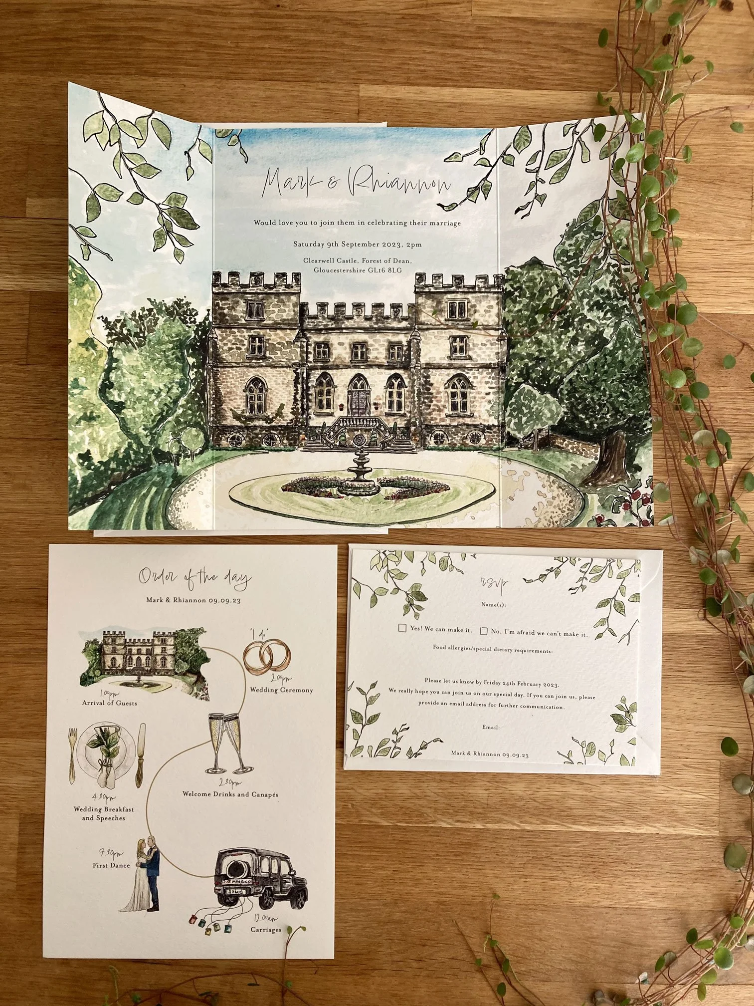 A beautifully illustrated wedding invitation suite by Feather & Ink Stationery featuring a hand painted portrait of Clearwell Castle on a folded card accompanied by a charming order of the day timeline and coordinating RSVP card with botanical detail