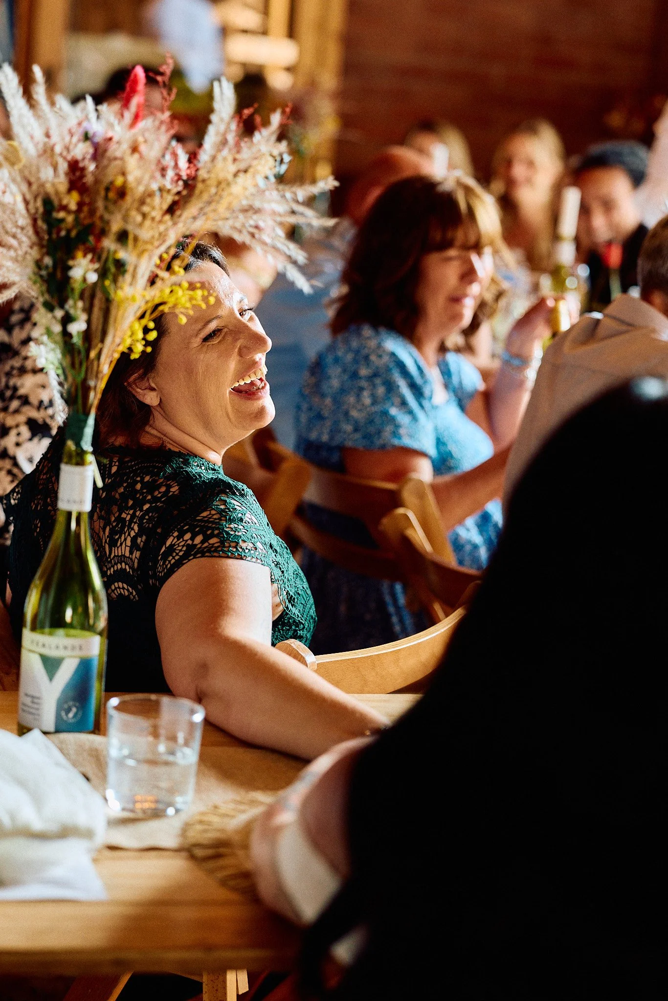Elizabeth Royse Photography captures weddings with a raw cinematic energy that blends candid intimacy, bold compositions and a film inspired aesthetic shown through moments like a bride feeding a horse on a sunlit lawn, chandelier lit staircases, smo