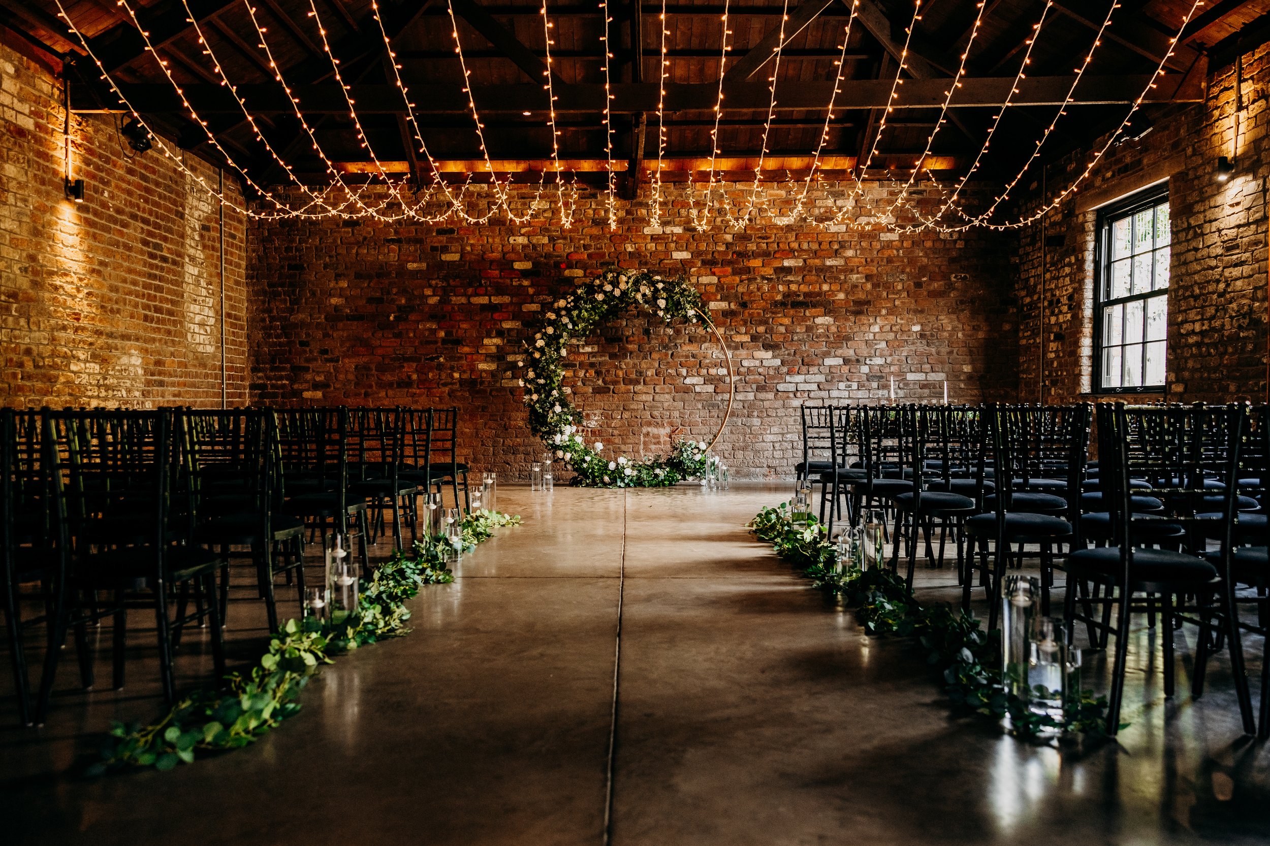 The aisle and wedding alter at the Engine Works, before any guests have arrived.